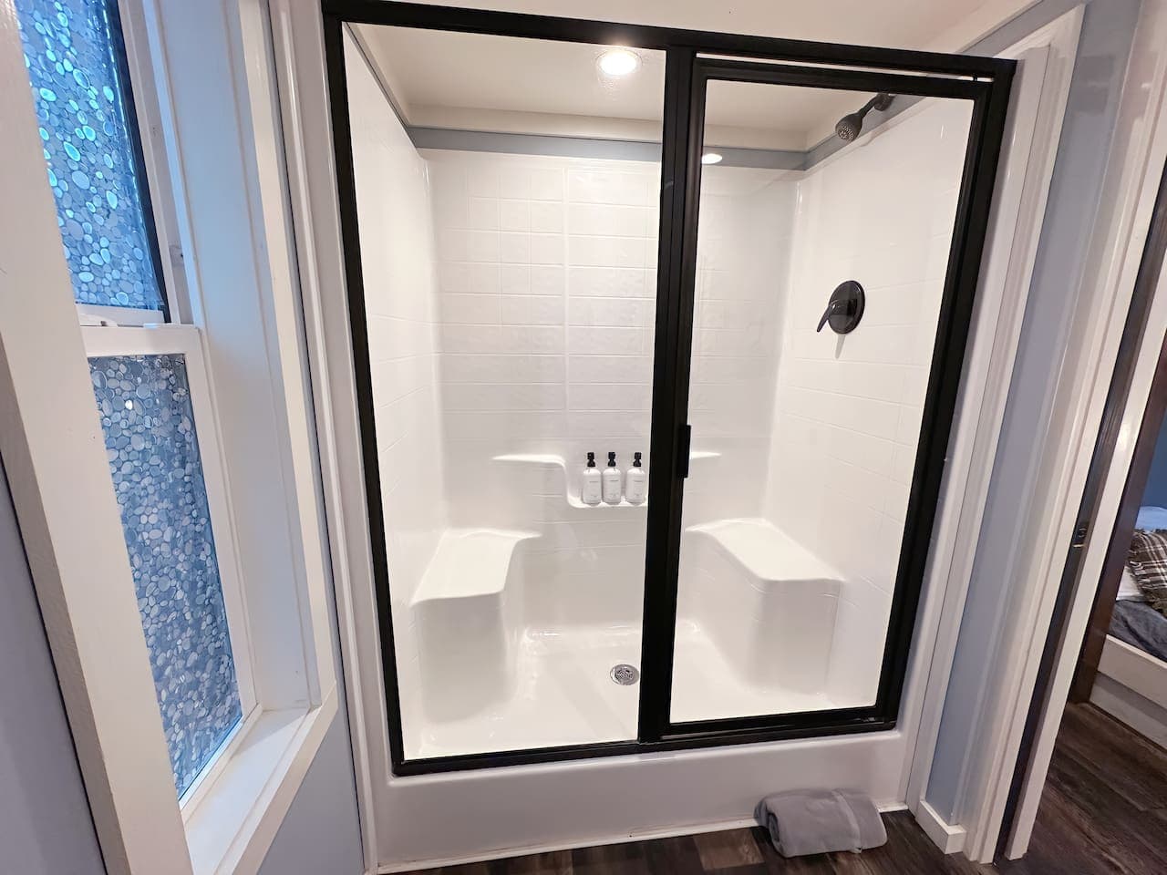 Moon River Mentone 2: A cozy full bath with a walk-in shower for easy relaxation.