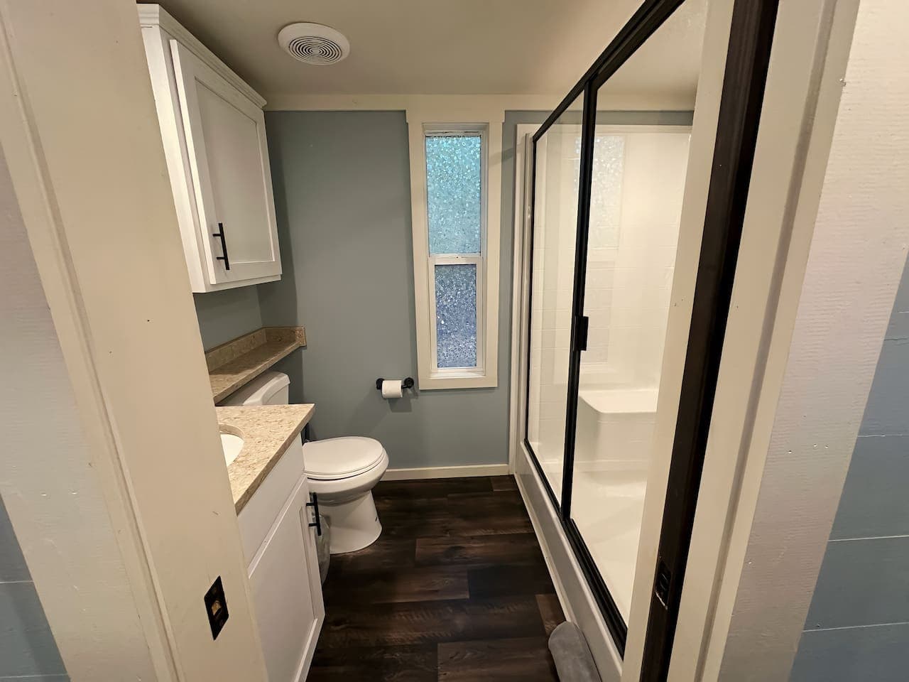 Moon River Mentone 2: Clean, modern full bath with a sleek walk-in shower.