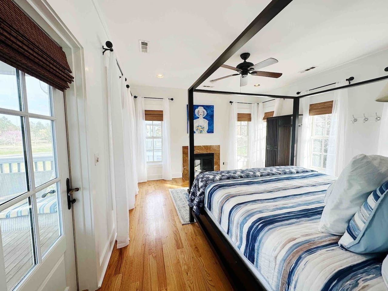 Master Bedroom on second floor with bathroom and screened in porch.