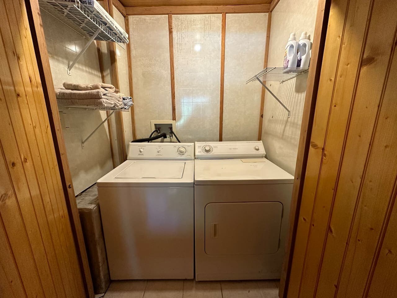 Laundry room with washer, dryer, and 2 laundry pods provided for your stay.
