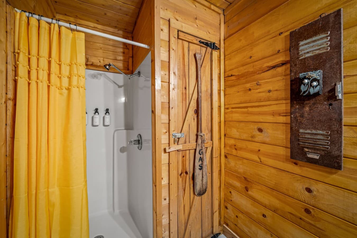 Master bathroom includes a shower stocked with shampoo, conditioner, and body wash.
