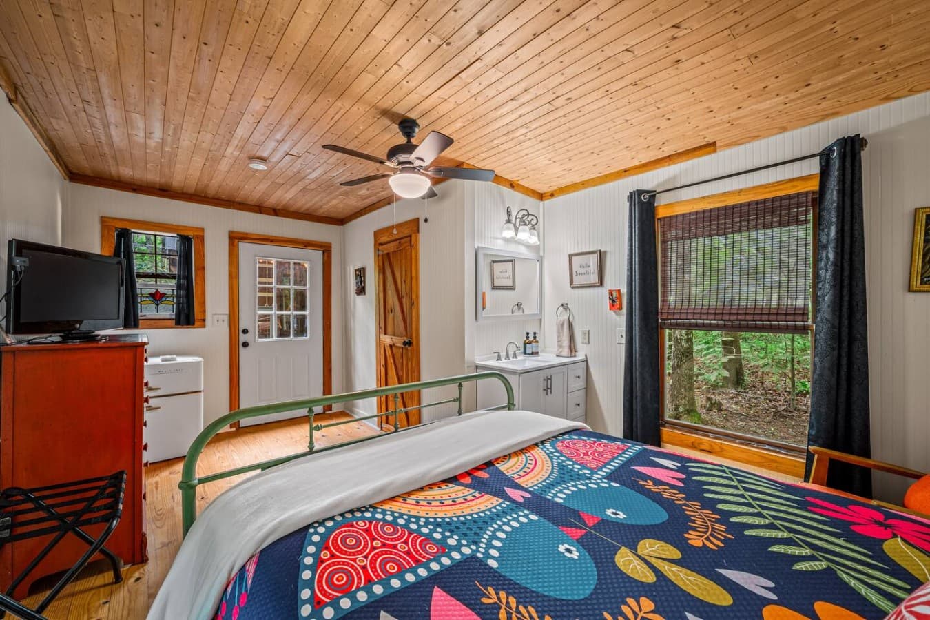 Logged Out! offers a queen bed, full bath, vanity, dresser, and mini fridge for added comfort.