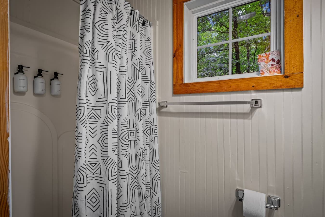 Shower inside the Logged Out! room’s full bathroom