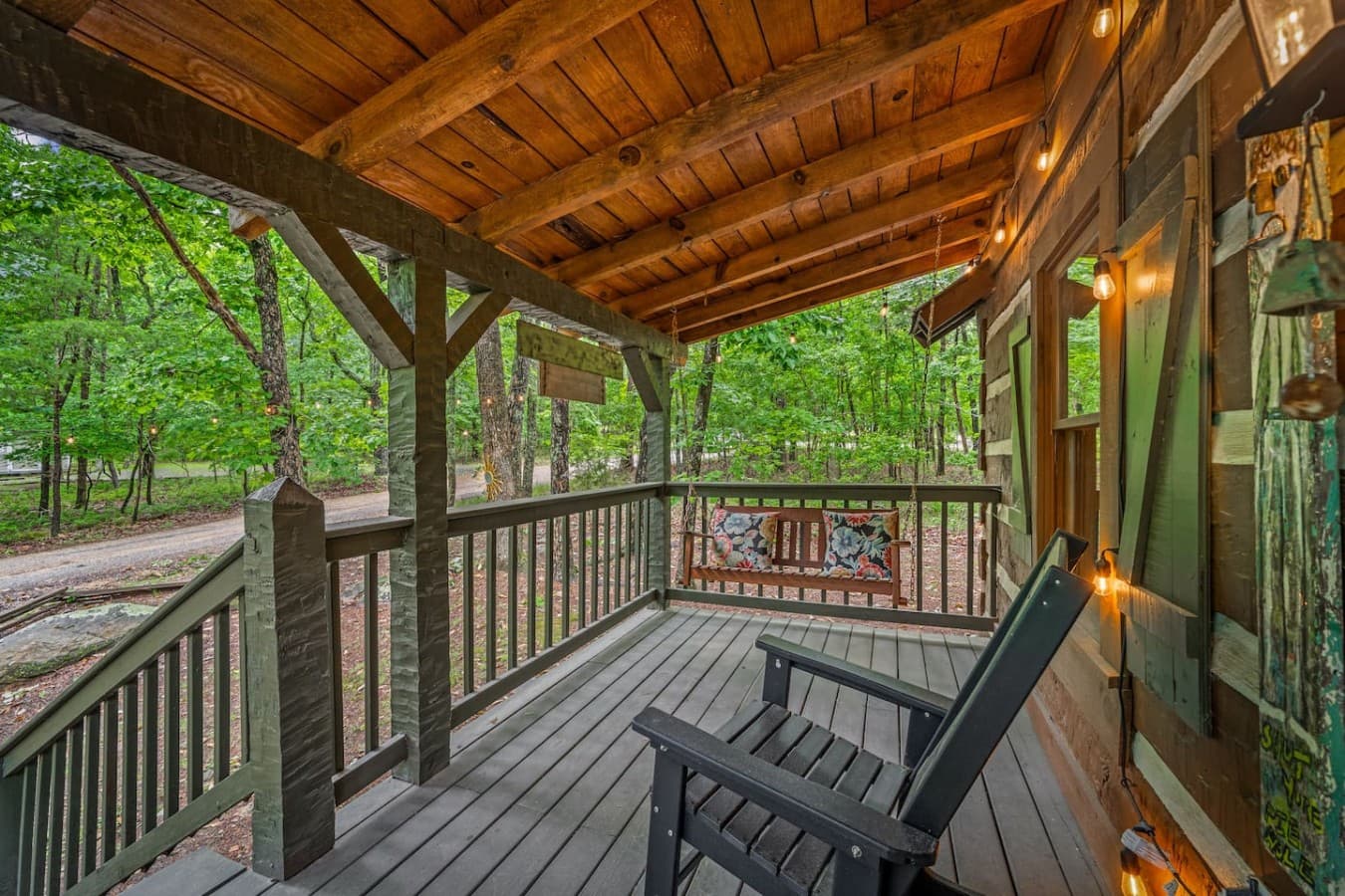 Porch swing on the front porch of Logged Inn.