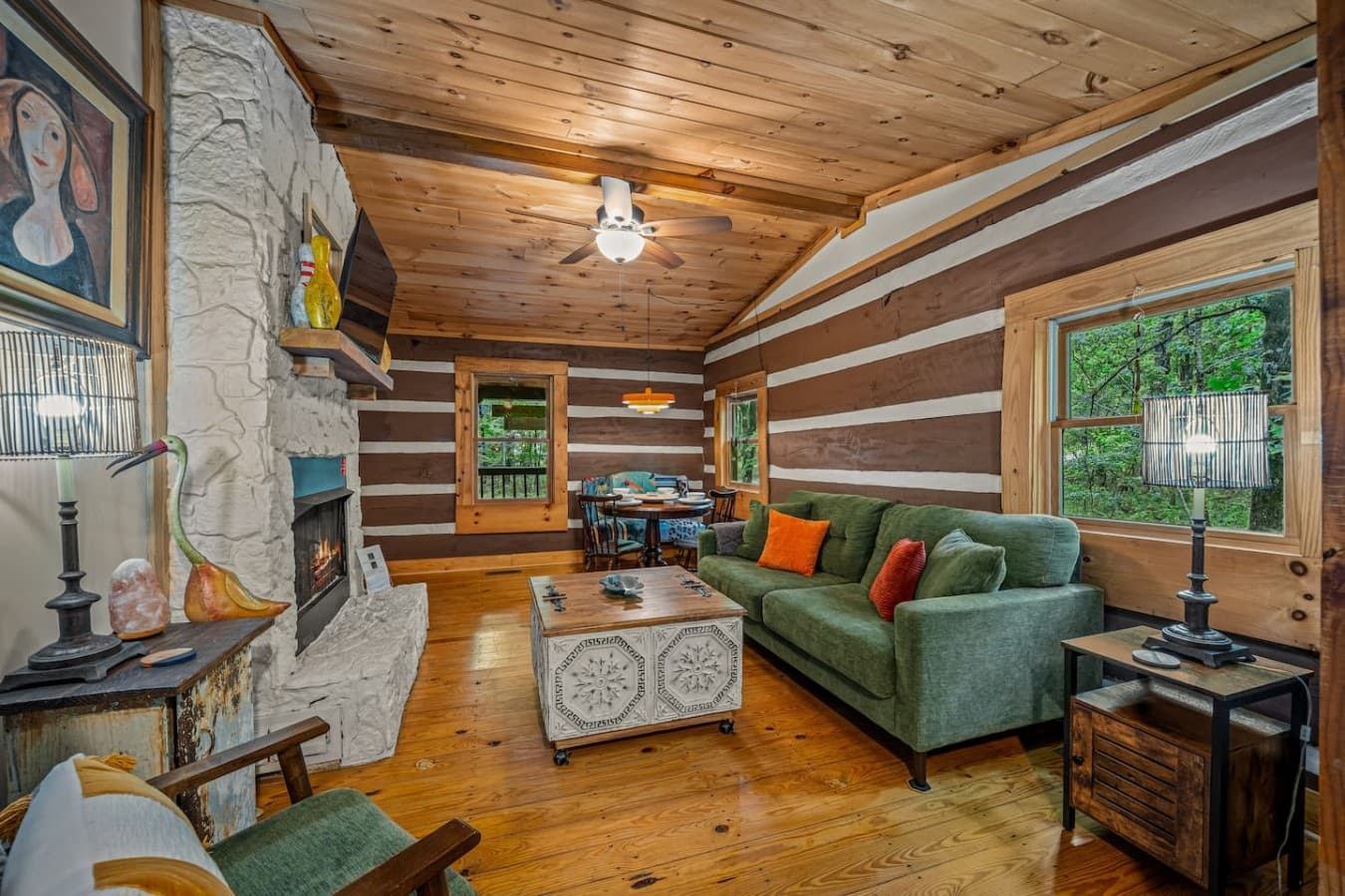 Comfy couch and dining table in living room.