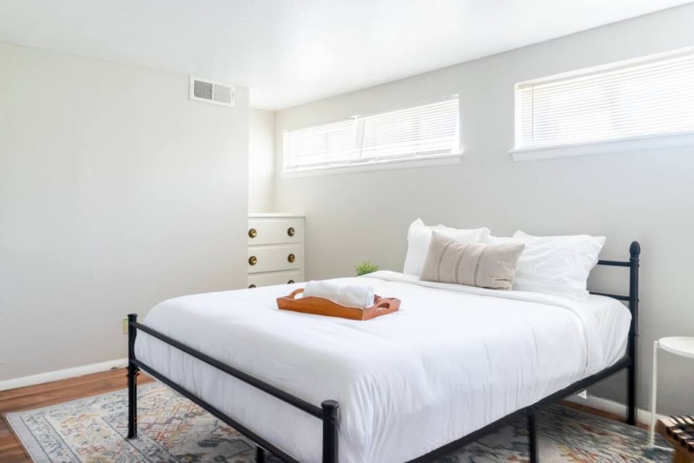 Rest easy in this bright bedroom with a comfy queen bed.