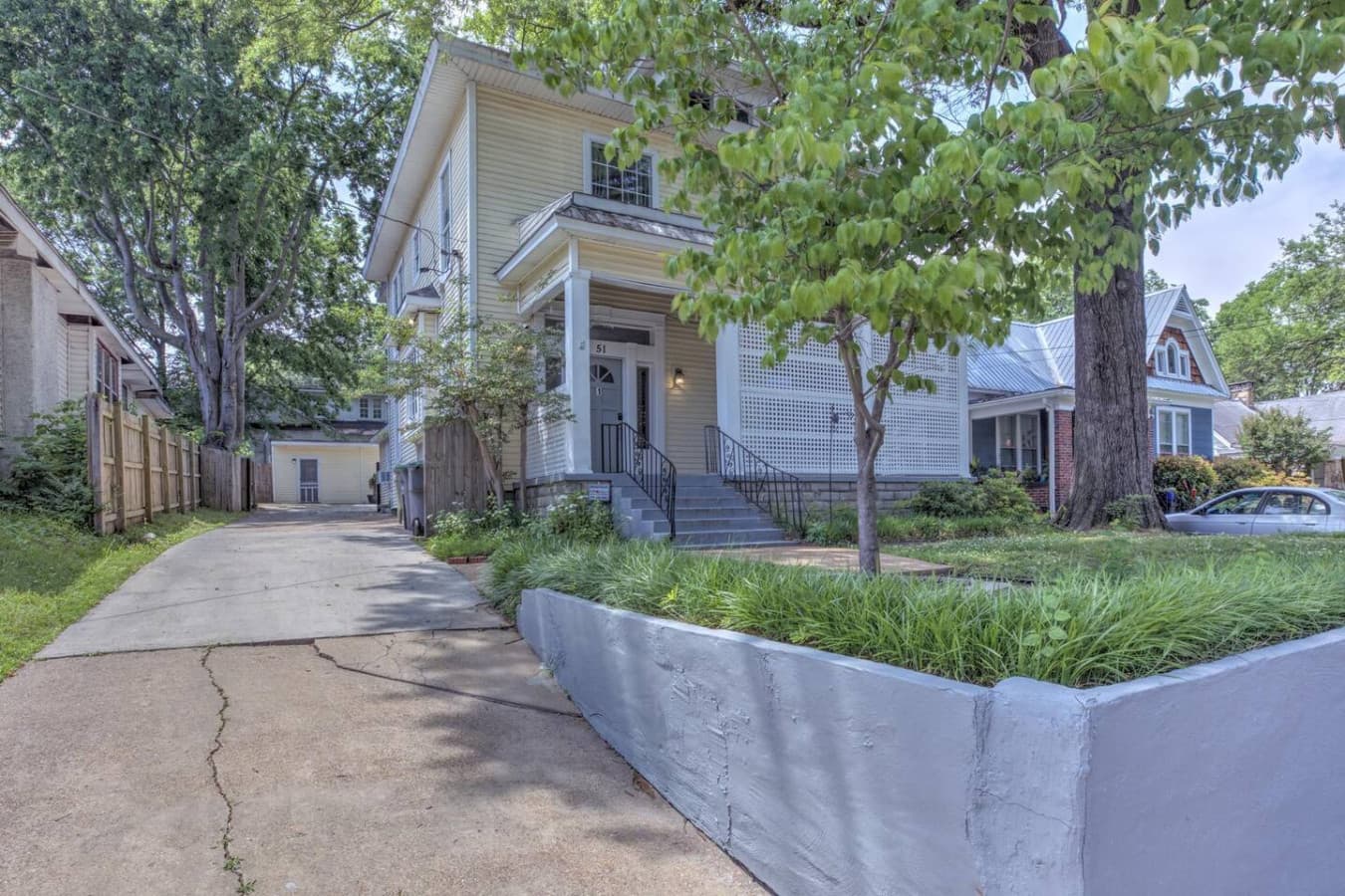 A welcoming exterior with classic charm and driveway access.