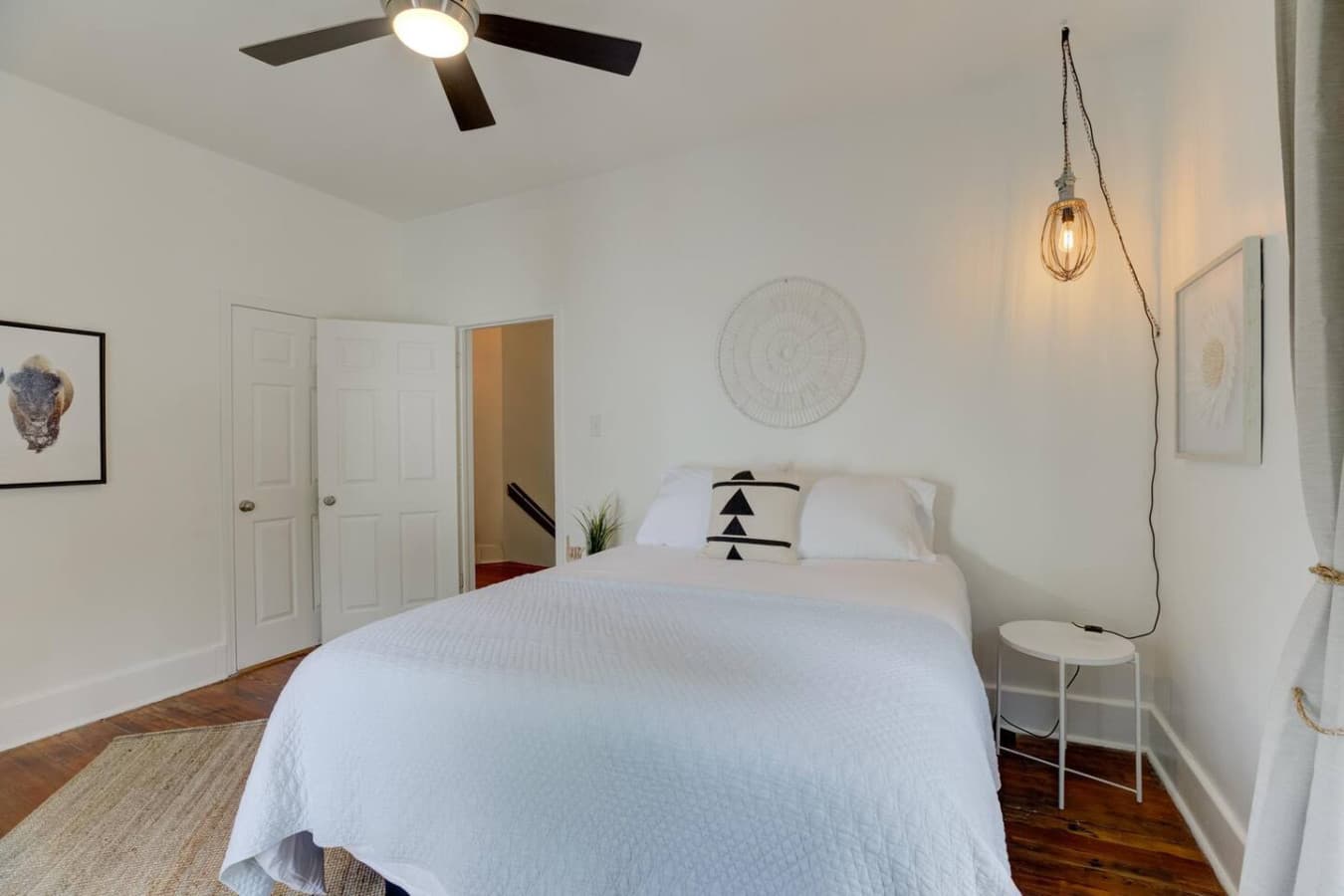 A cheerful, bright bedroom with a queen bed to recharge and unwind.