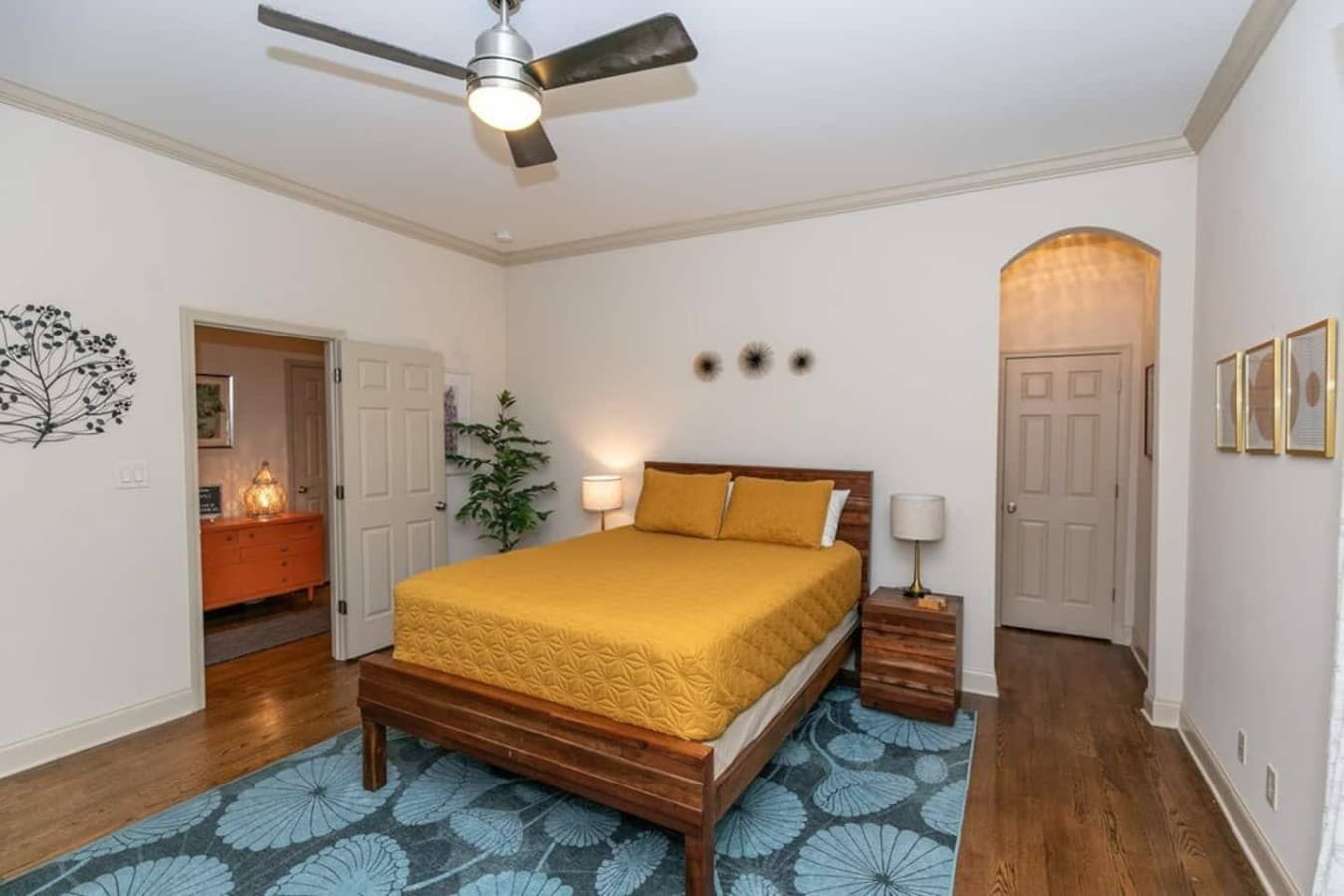 Queen bedroom with extra space for an additional guest.