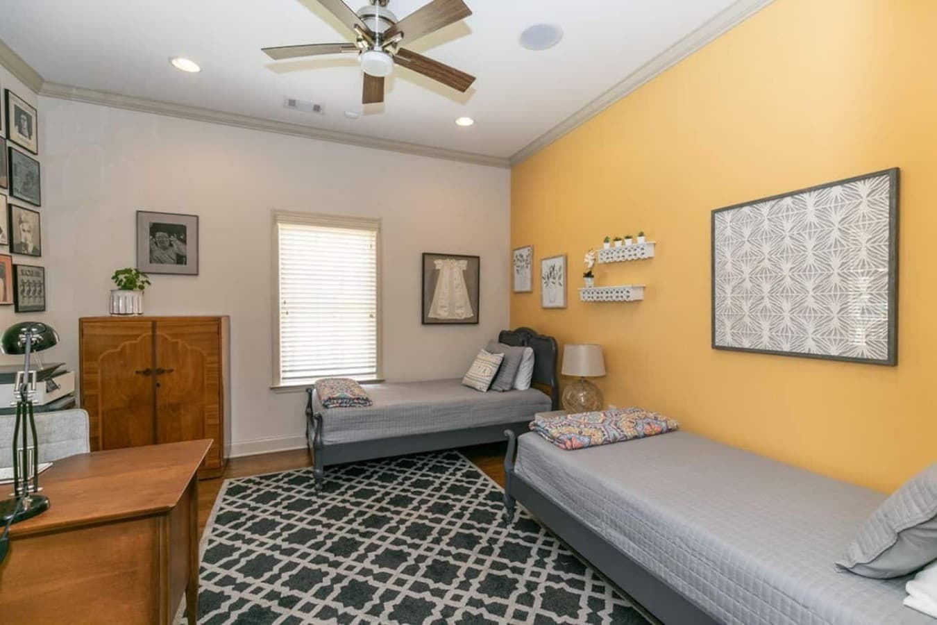 Twin bedroom and workspace built for flexible stays.