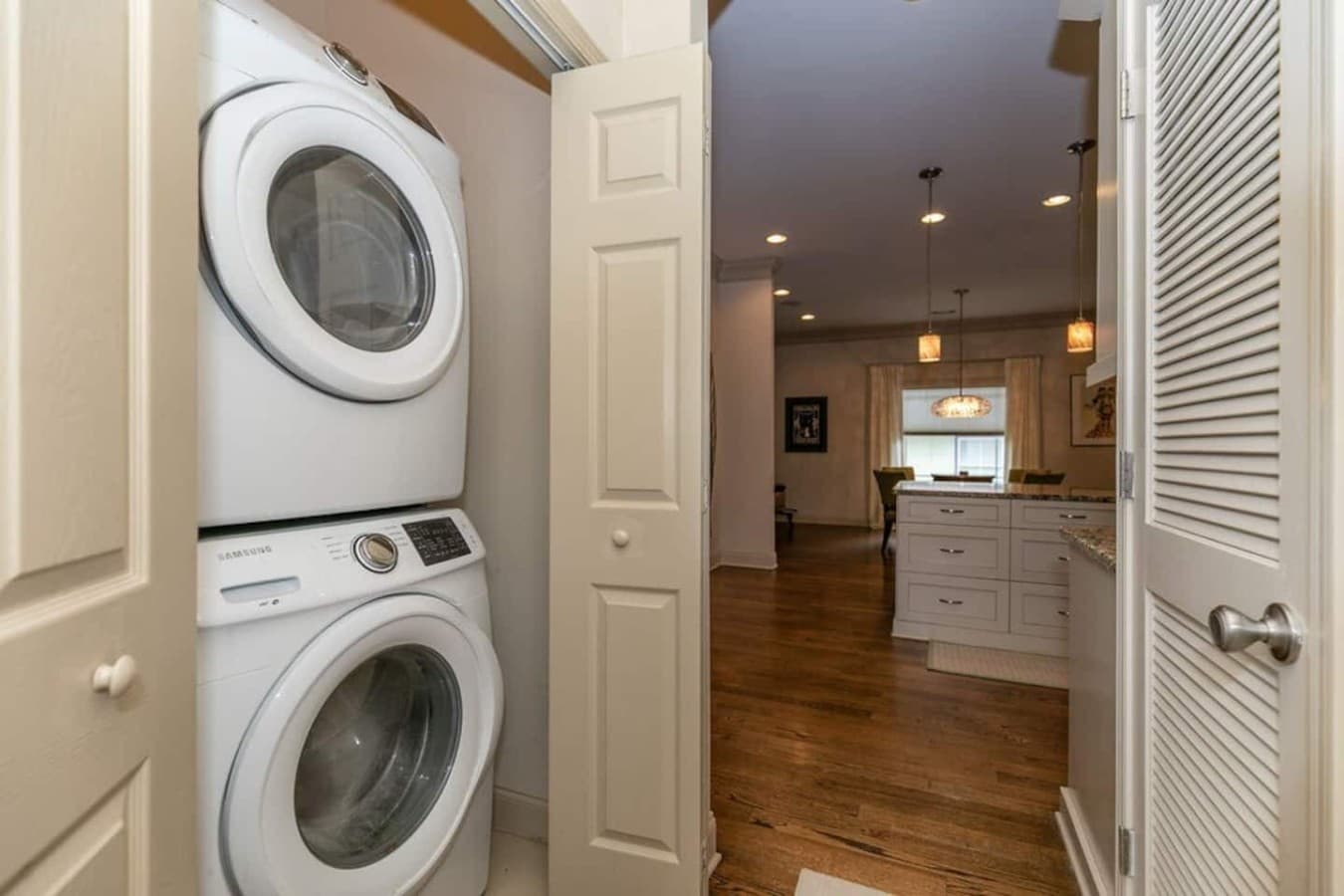 Laundry closet located in hallway off kitchen.