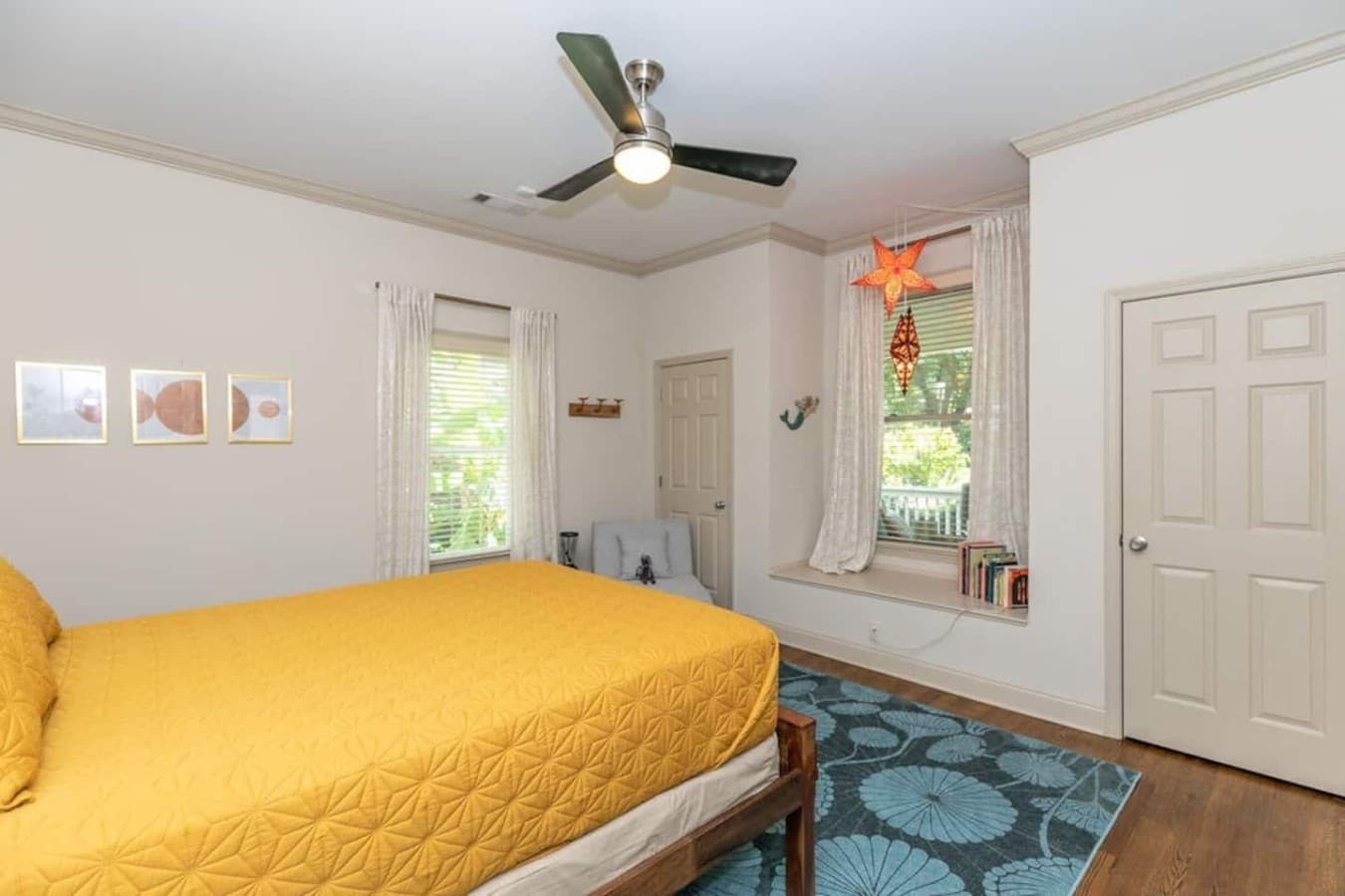 A thoughtfully styled bedroom with plenty of natural light.