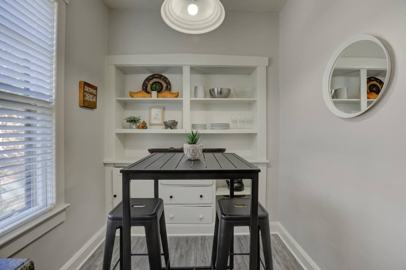 Casual dining for two with elevated seating and an easygoing feel.