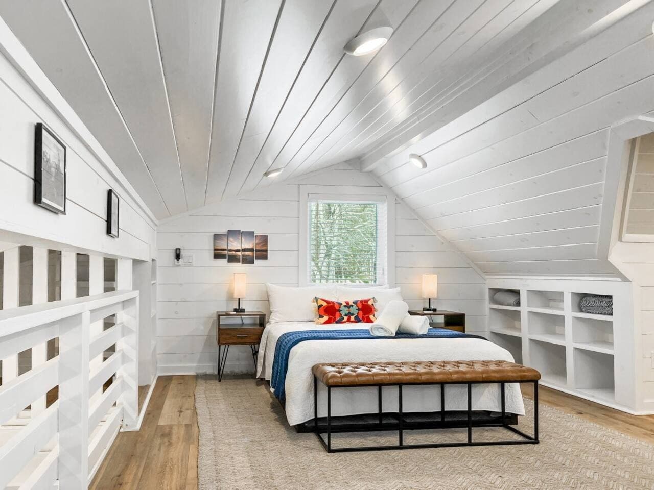 The queen loft bedroom sits upstairs with natural light and quirky niches.