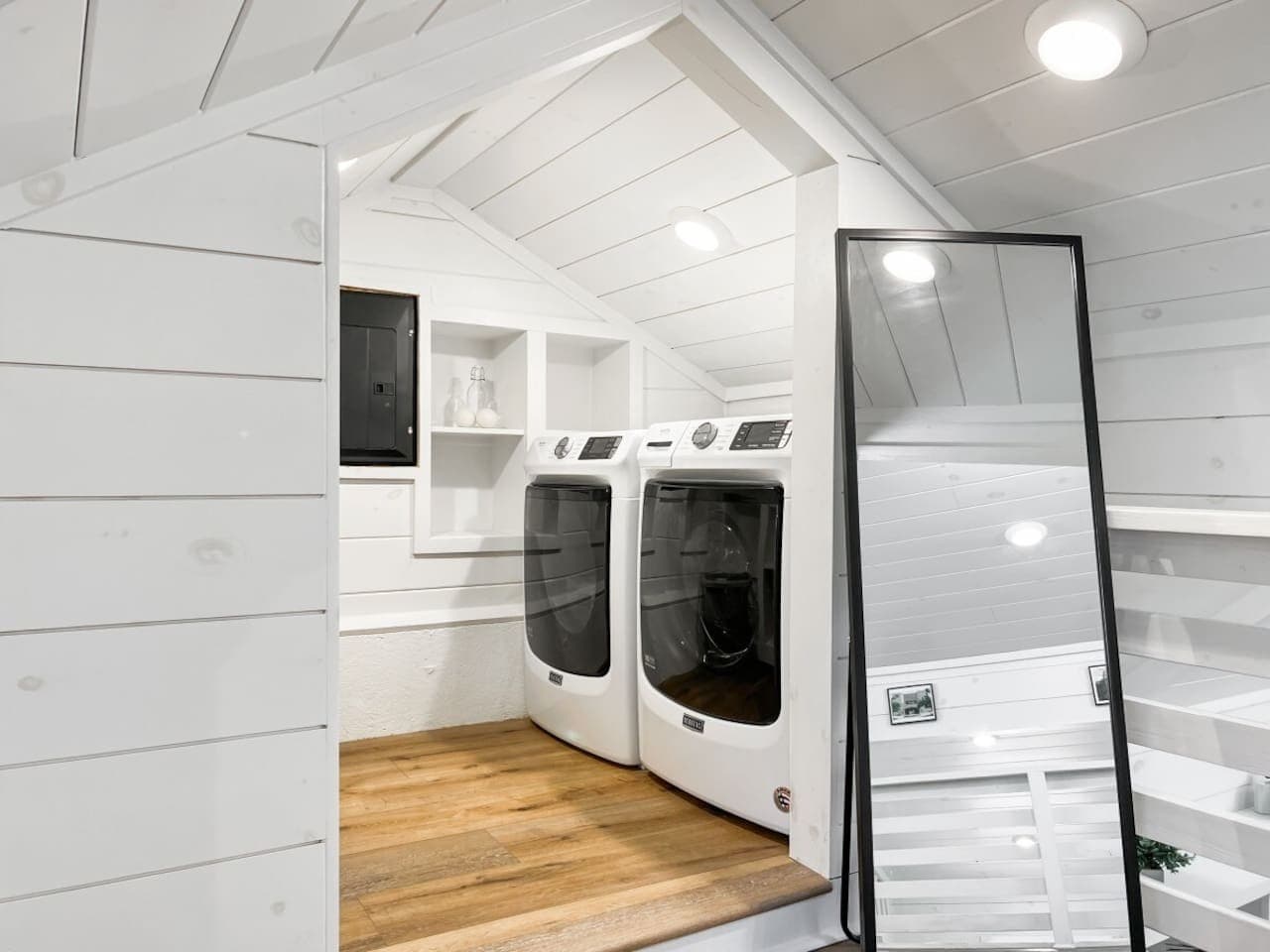 The upstairs loft includes clever built-ins and a laundry area that makes longer stays easier.