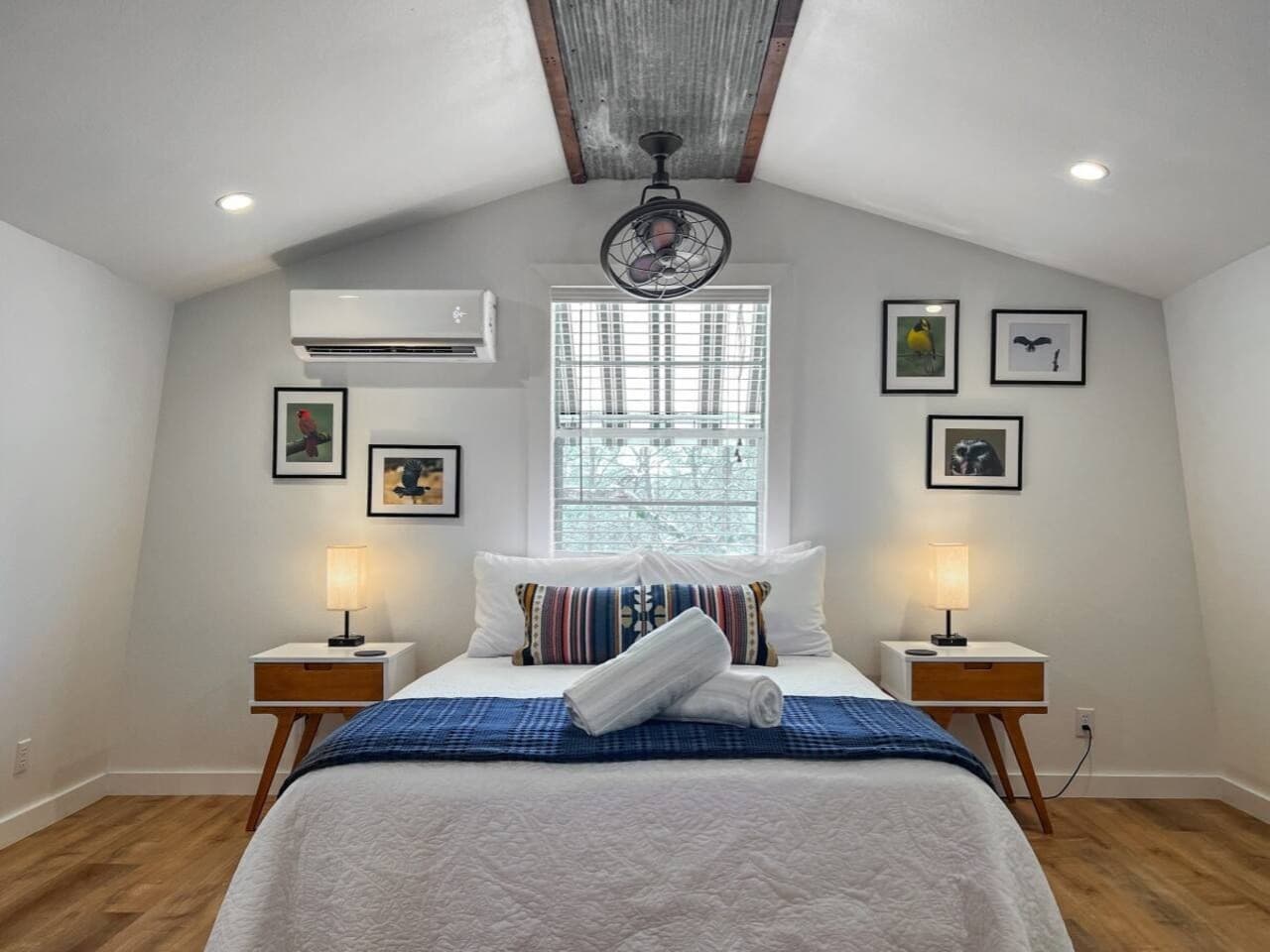 Sleep upstairs in a private-feeling suite with natural light and wooded views.