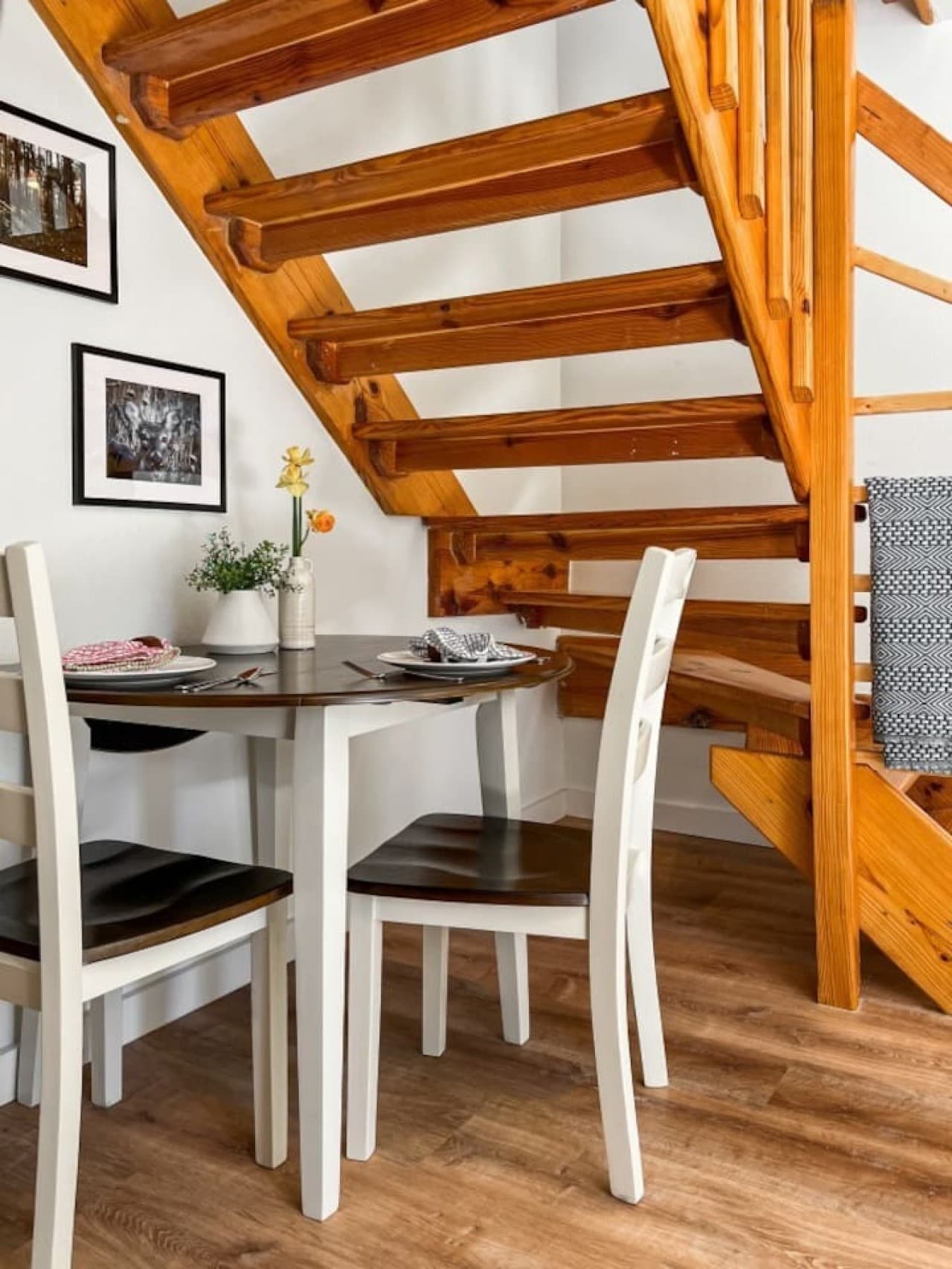 The sweetest little spot for a cozy meal tucked under the stairs!