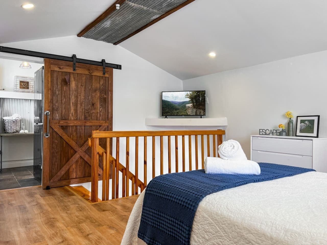 The sunny spacious bedroom has its own corrugated details.