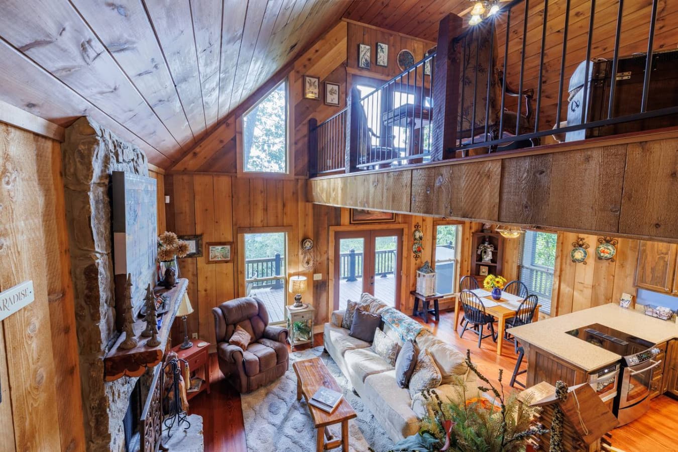 Cozy, Rustic Interior with Wood Burning Fireplace and Views From Every Seat.