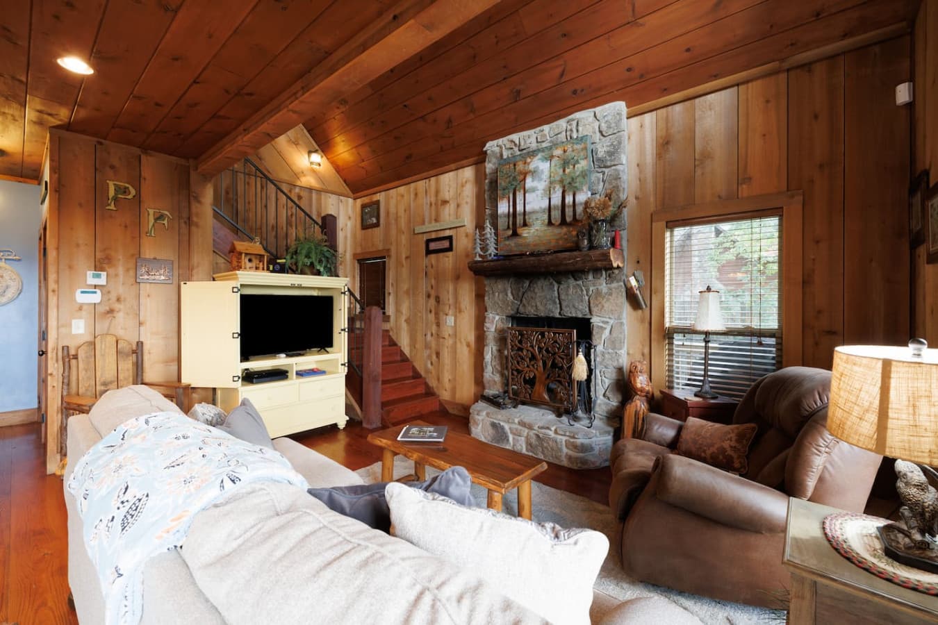 - Cozy, Rustic Wood Burning Fireplace in Living Room. 
- TV & WiFi