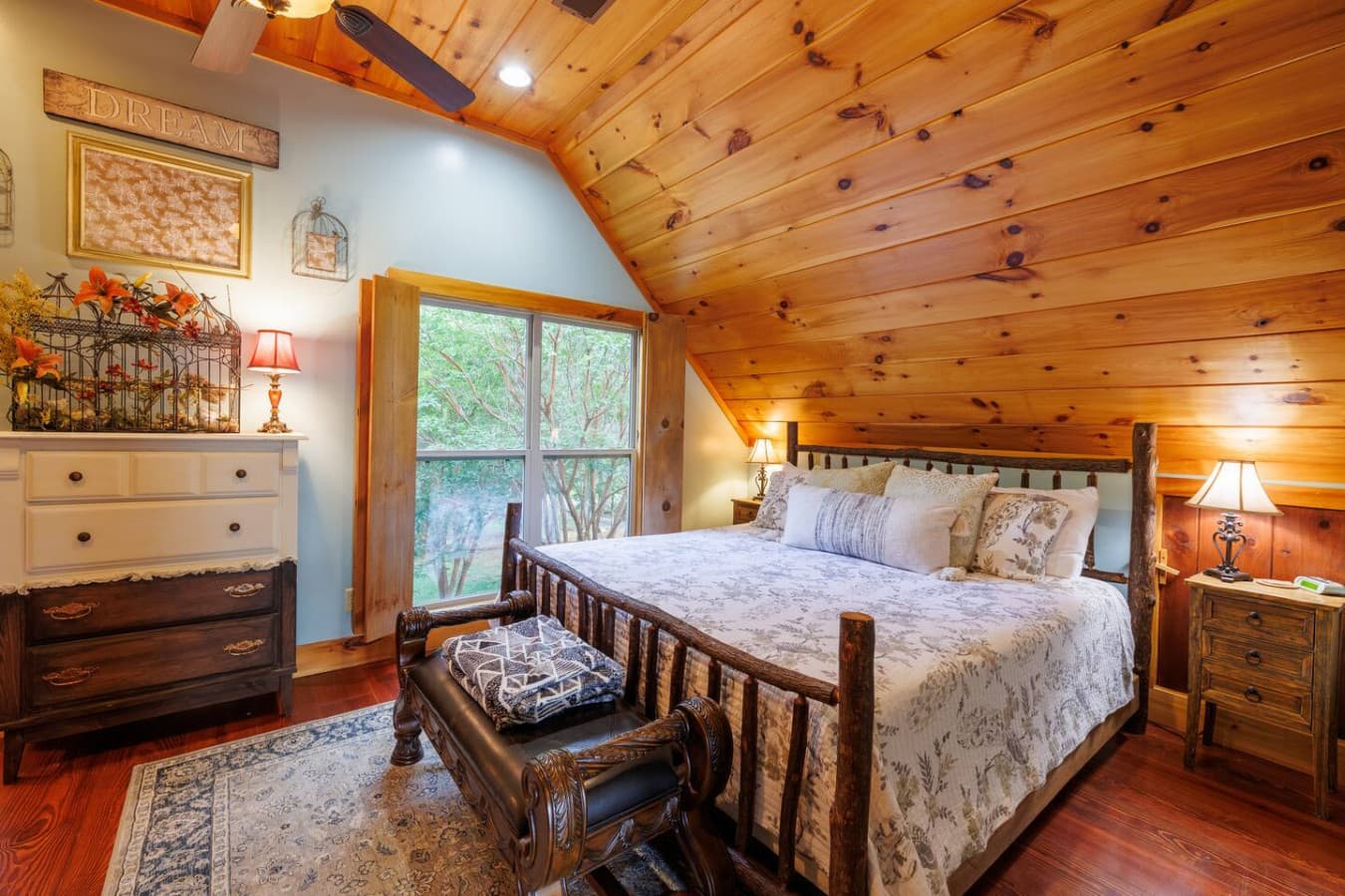 BEDROOM 2: Cozy, comfortable, and rustic cottage bedroom upstairs. 
The king bed is handmade by a Mentone local. The room also has a dresser for clothing.