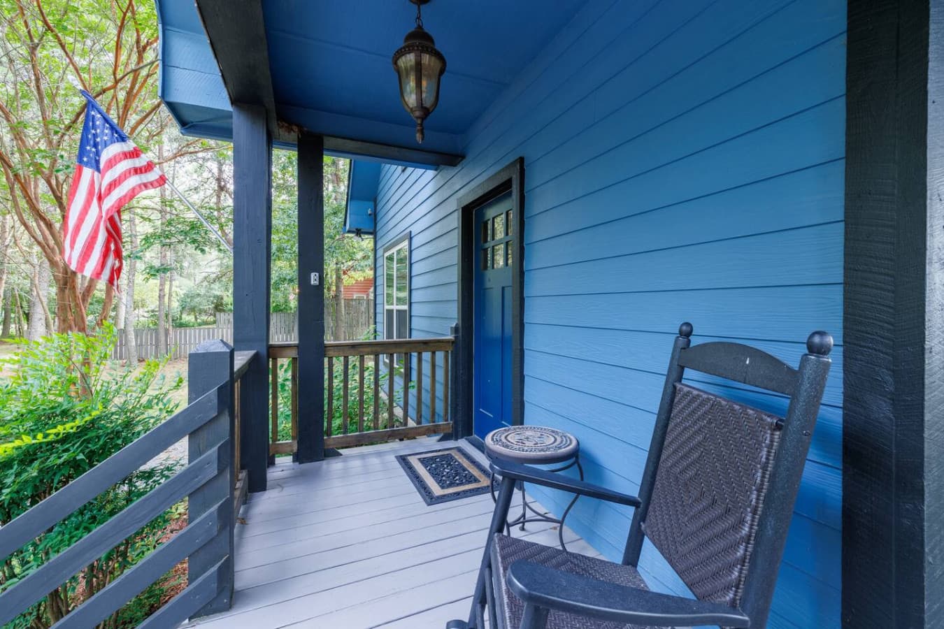 Welcoming front porch entry with rocking chair.