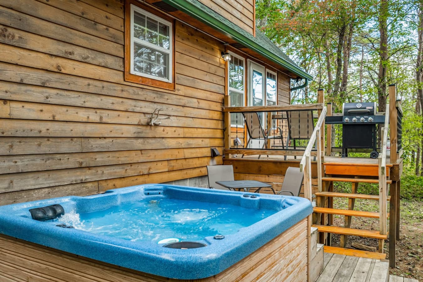 Unwind and relax in the soothing hot tub, perfect for a peaceful soak.