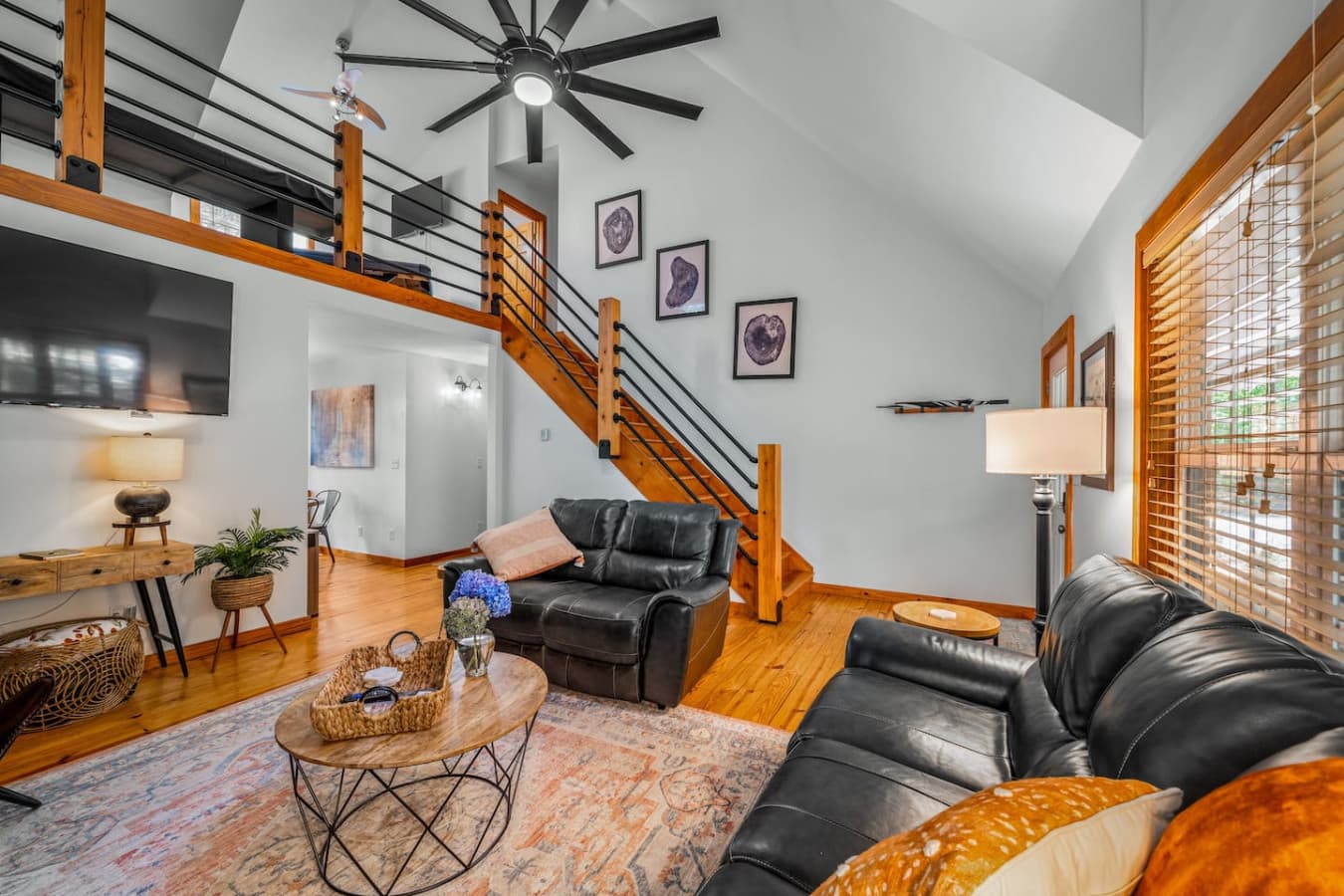 Cozy up in the living room with a Smart TV for your entertainment. Stairs up to the 2nd floor.