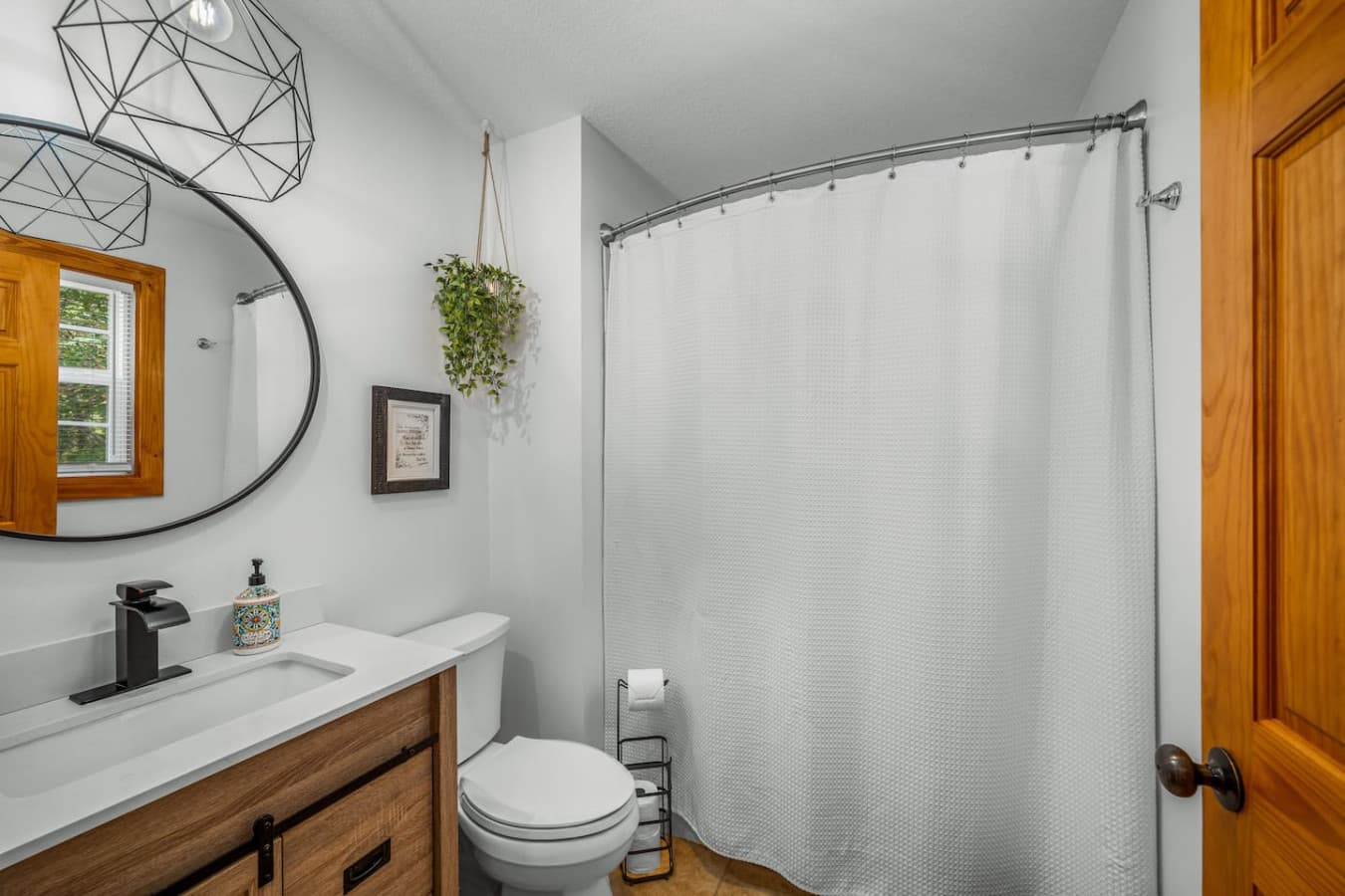 Full bath attached to the master bedroom on the main floor, featuring a tub and shower for ultimate relaxation.