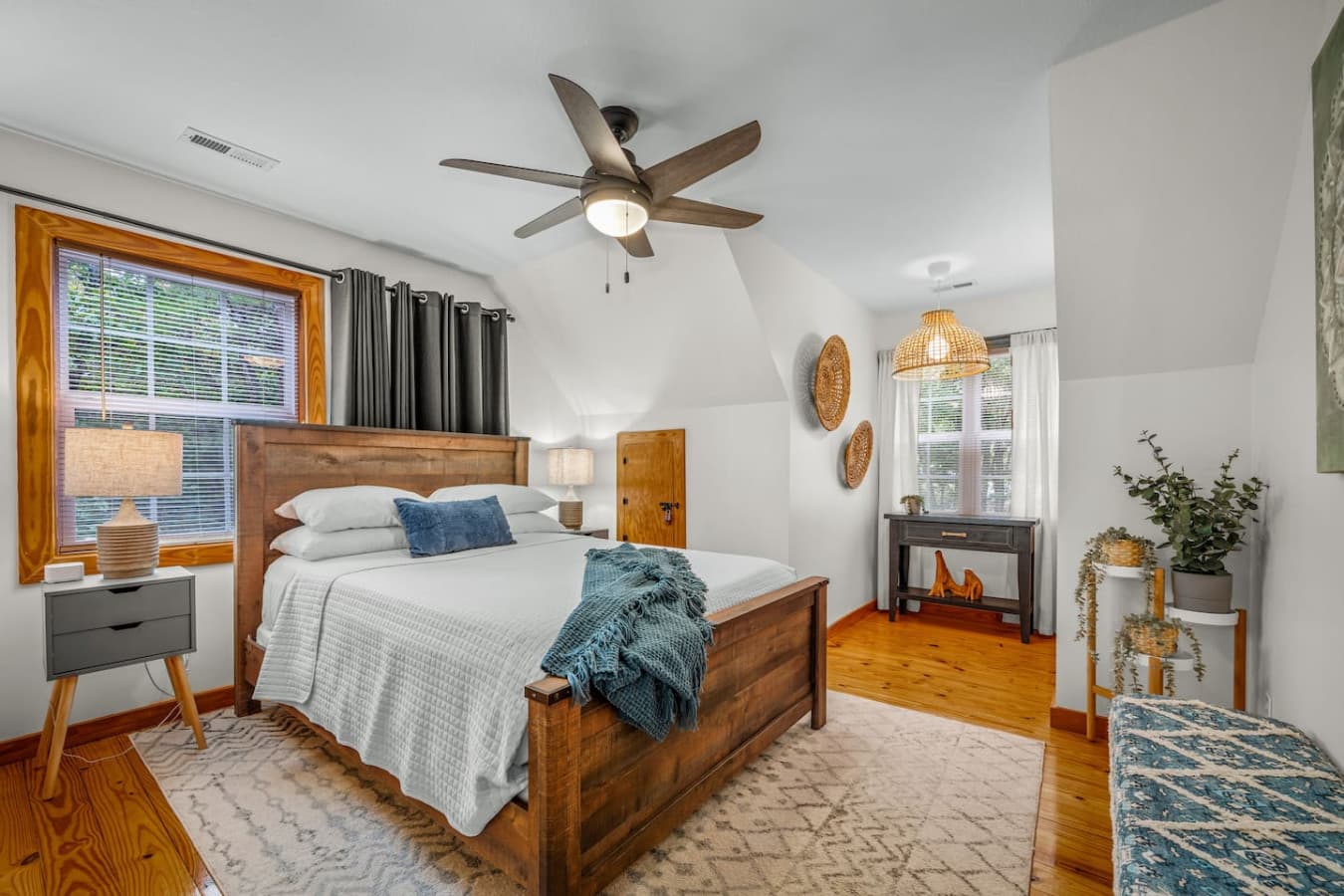 Upstairs bedroom also offers a cozy nook and a ceiling fan.