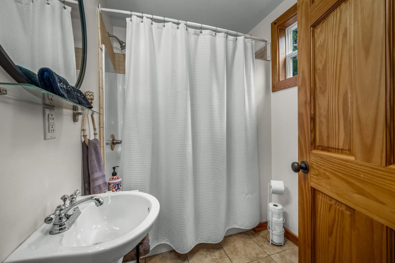 Full bathroom located across from the second bedroom upstairs, offers a bath tub/shower combo.