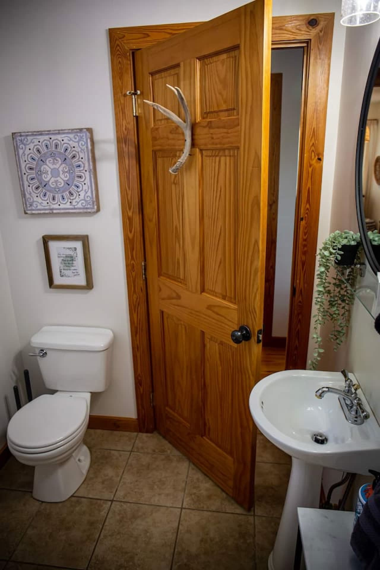 Full bathroom located across from the second bedroom upstairs, offering convenience and comfort.