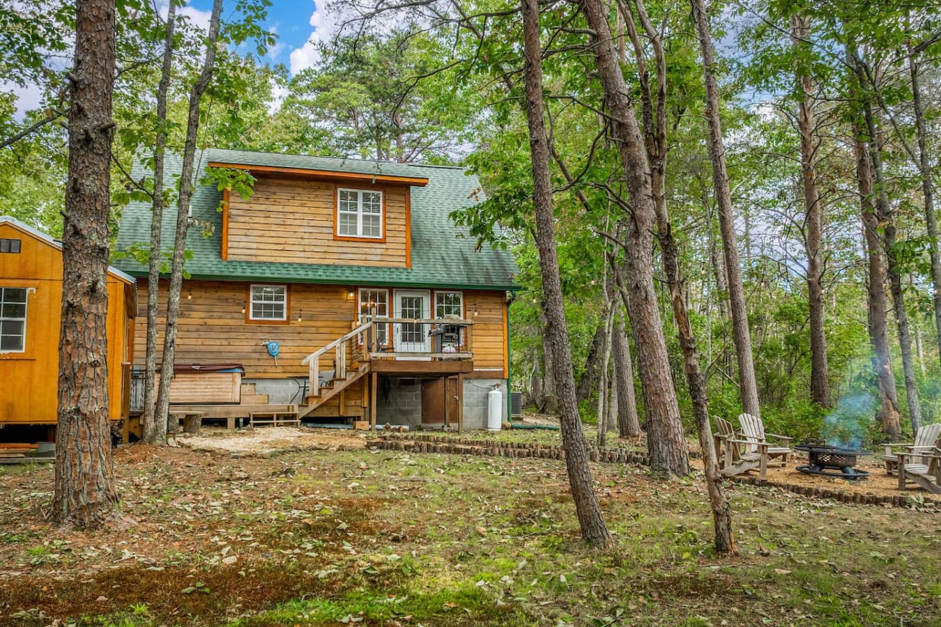 Enjoy the backyard with a hot tub, back porch, grill, and fire pit – perfect for relaxation and outdoor fun.