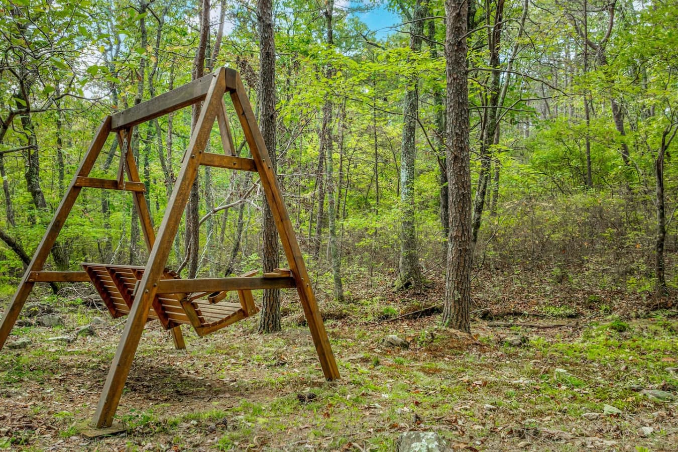 Relax on the backyard swing and enjoy the peaceful surroundings. Swing by wet weather stream.