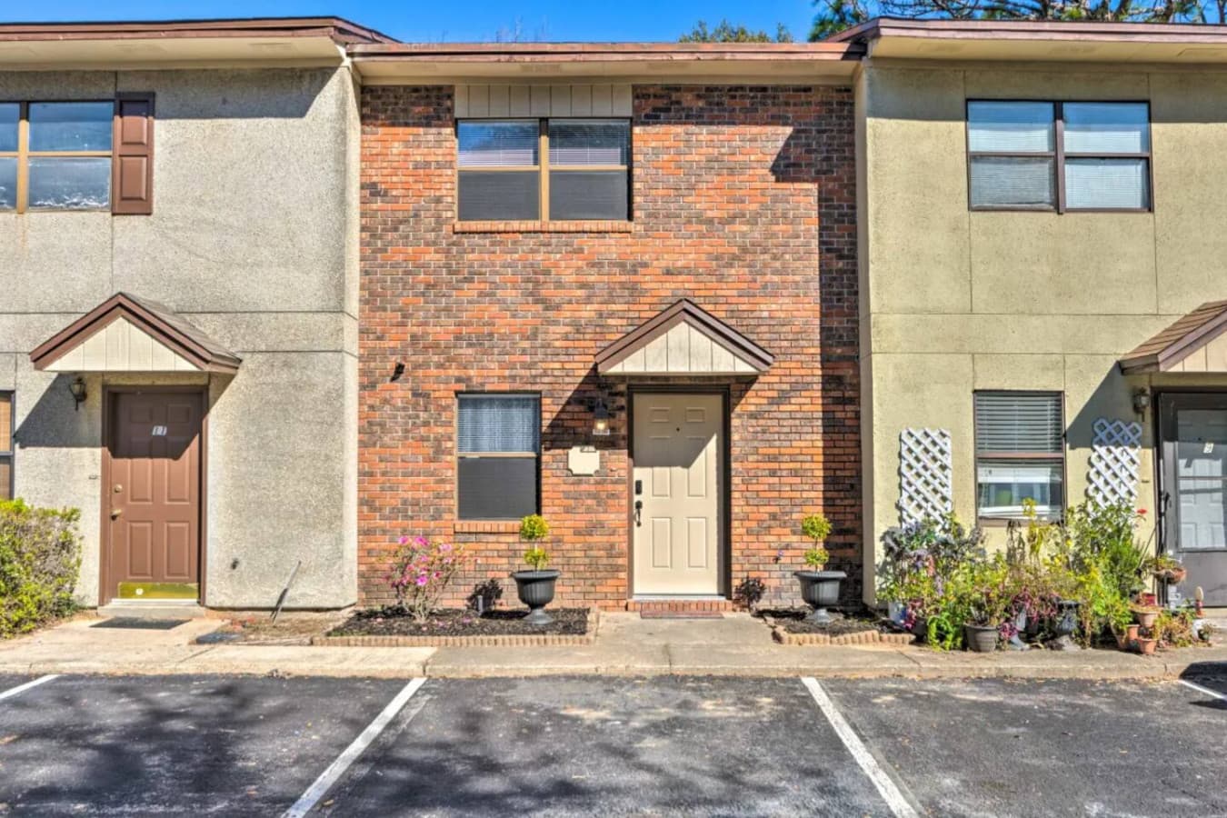 Charming exterior with a welcoming feel! We have a convenient on-site parking for your stay.