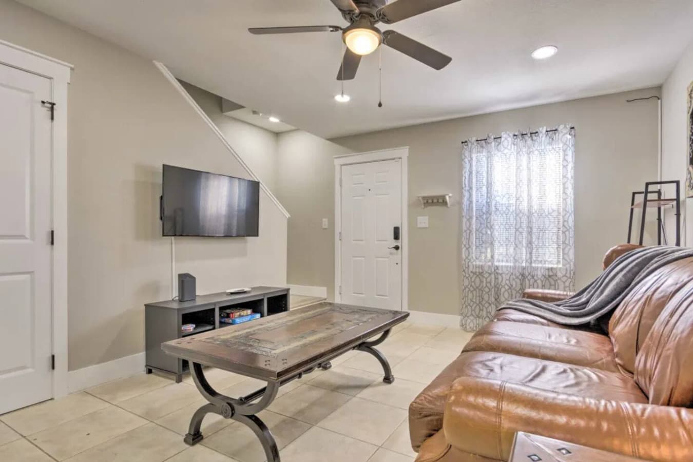 This roomy living area offers the perfect blend of comfort and coastal charm.