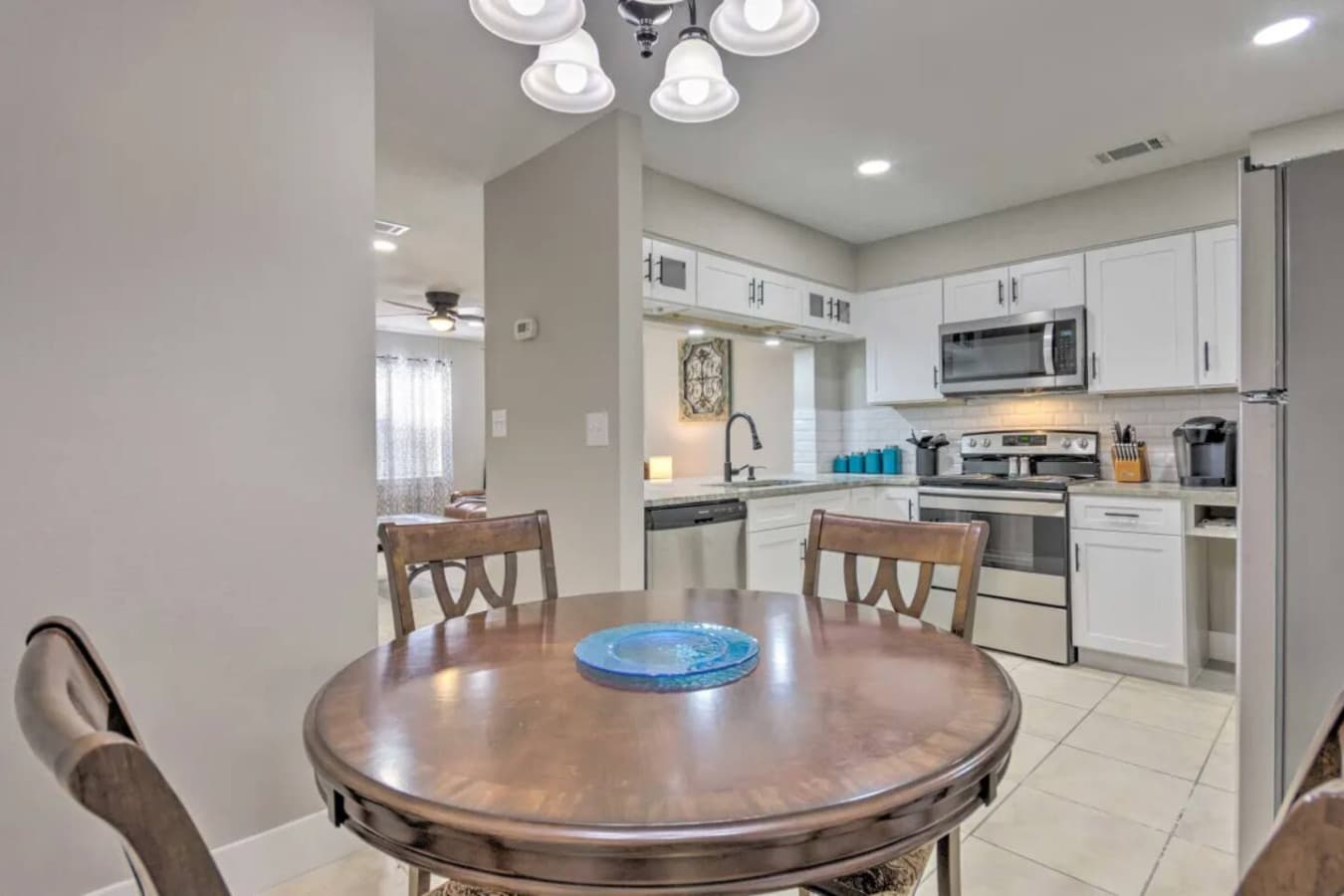 The dining table, set in a smooth and serene setting, creates the perfect atmosphere for a relaxed dining experience.