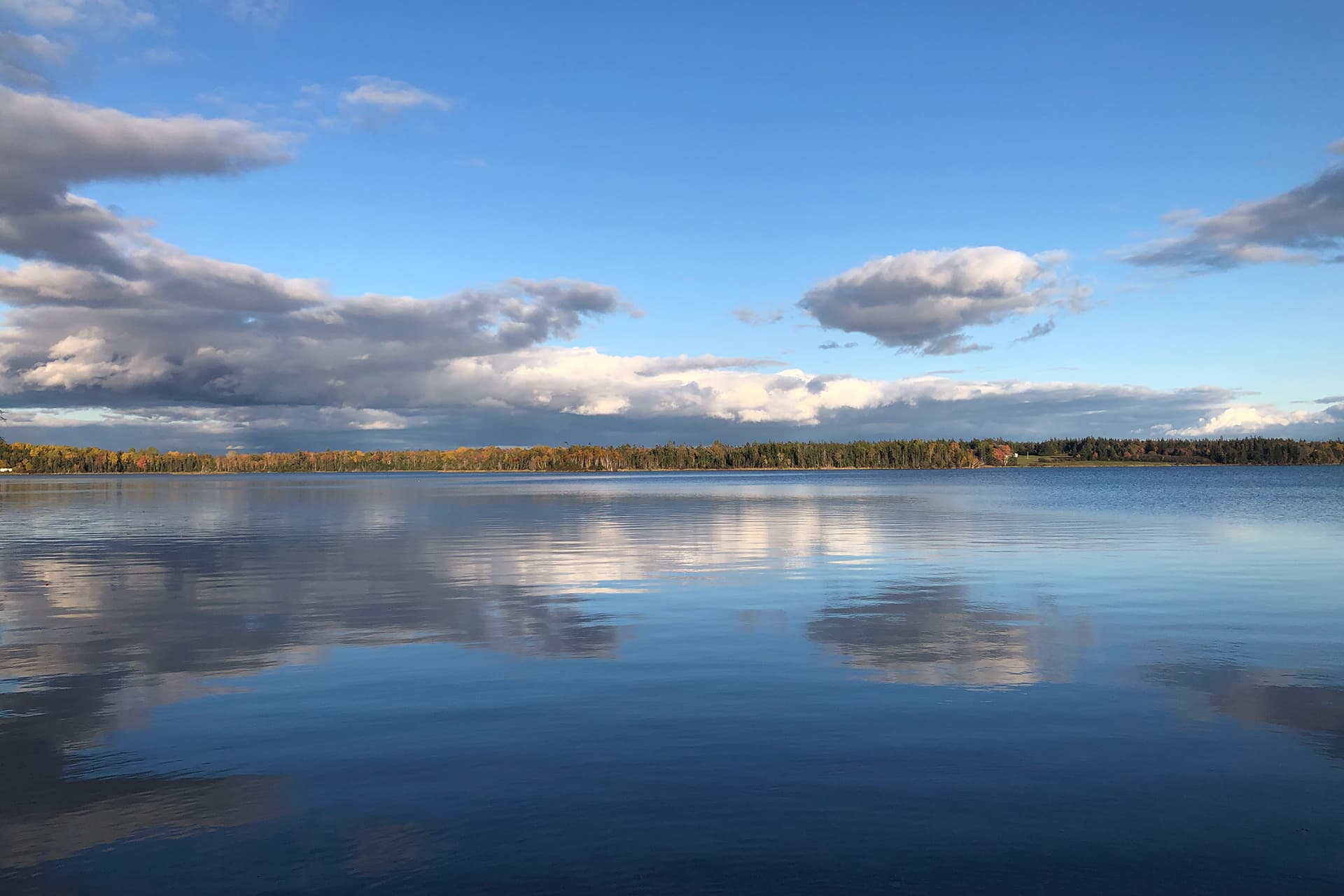 Backyard clouds over the lake in the fall
