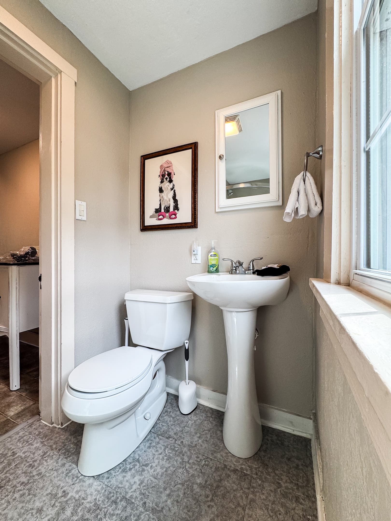 The second bathroom is on the upper level off the hall and has a step in shower with views of historic downtown WashMo at Aussie Cottage.