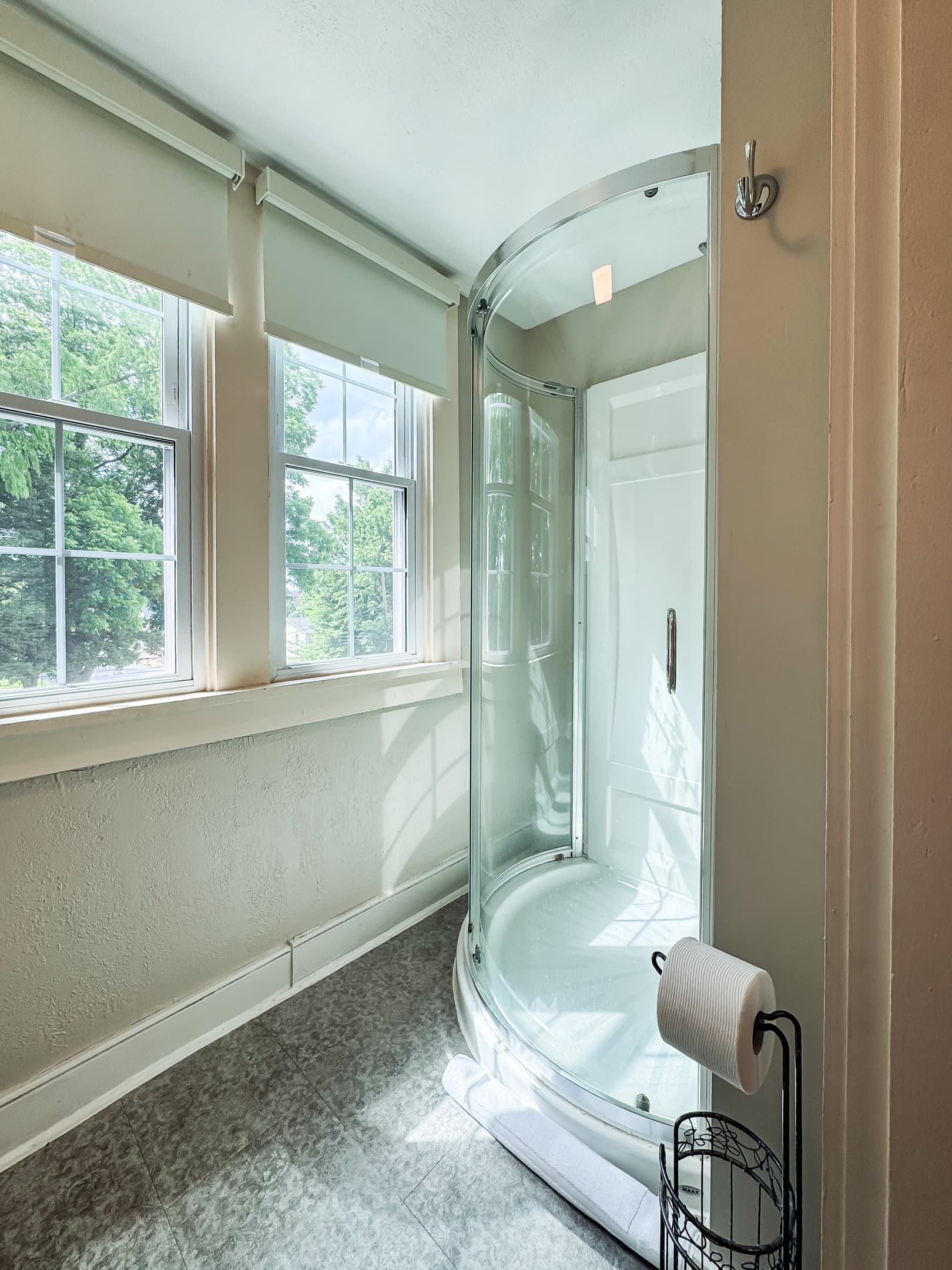 The second bathroom is on the upper level off the hall and has a step in shower at Aussie Cottage.
