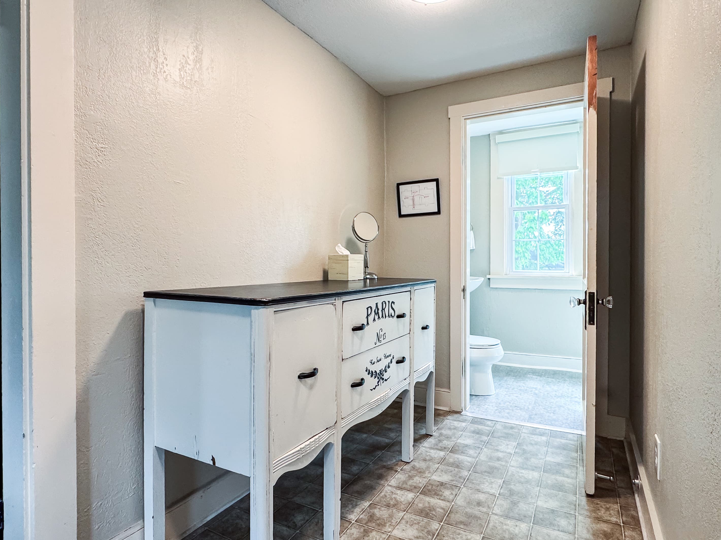 Entrance to the second bathroom on the upper level and bathroom has a step in shower at Aussie Cottage.