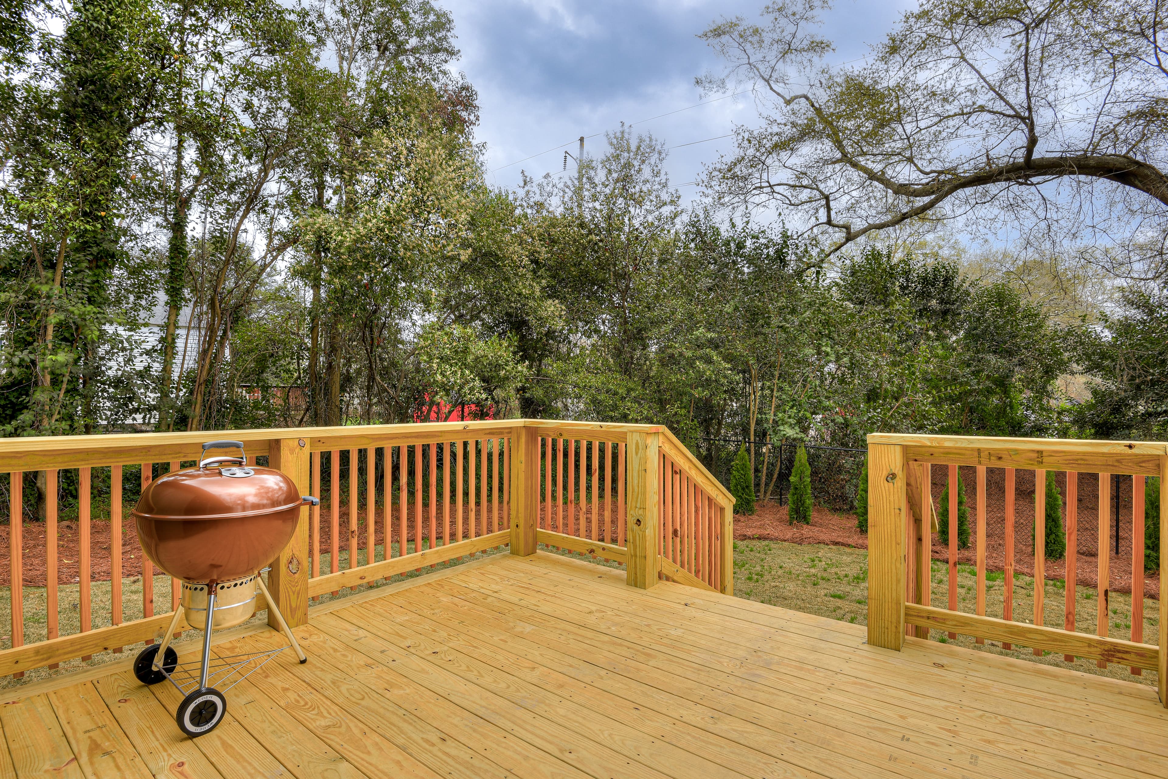 Deck off Screened-In Back Porch with Charcoal Grill