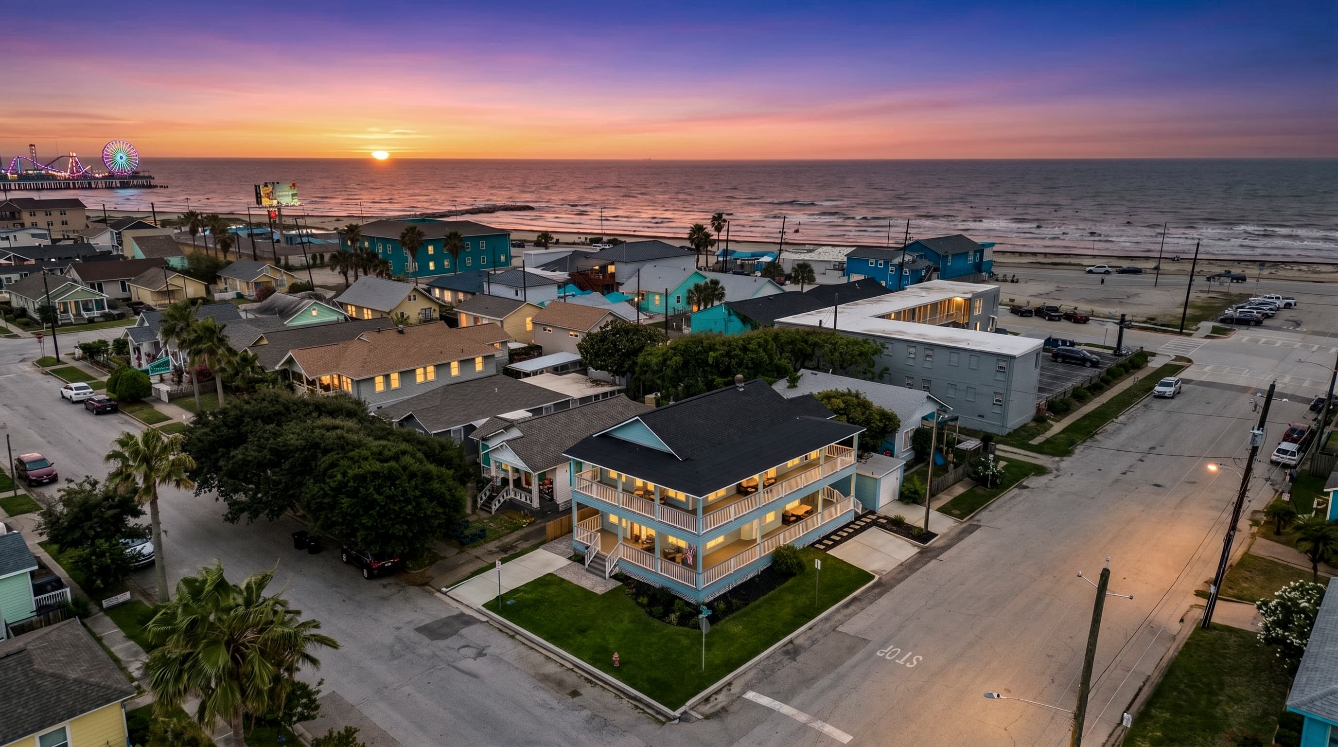 Sunset over the Galveston Seawall — The Lookout at R½ sits in the heart of it all, with Pleasure Pier and the Gulf of Mexico just a short walk away.