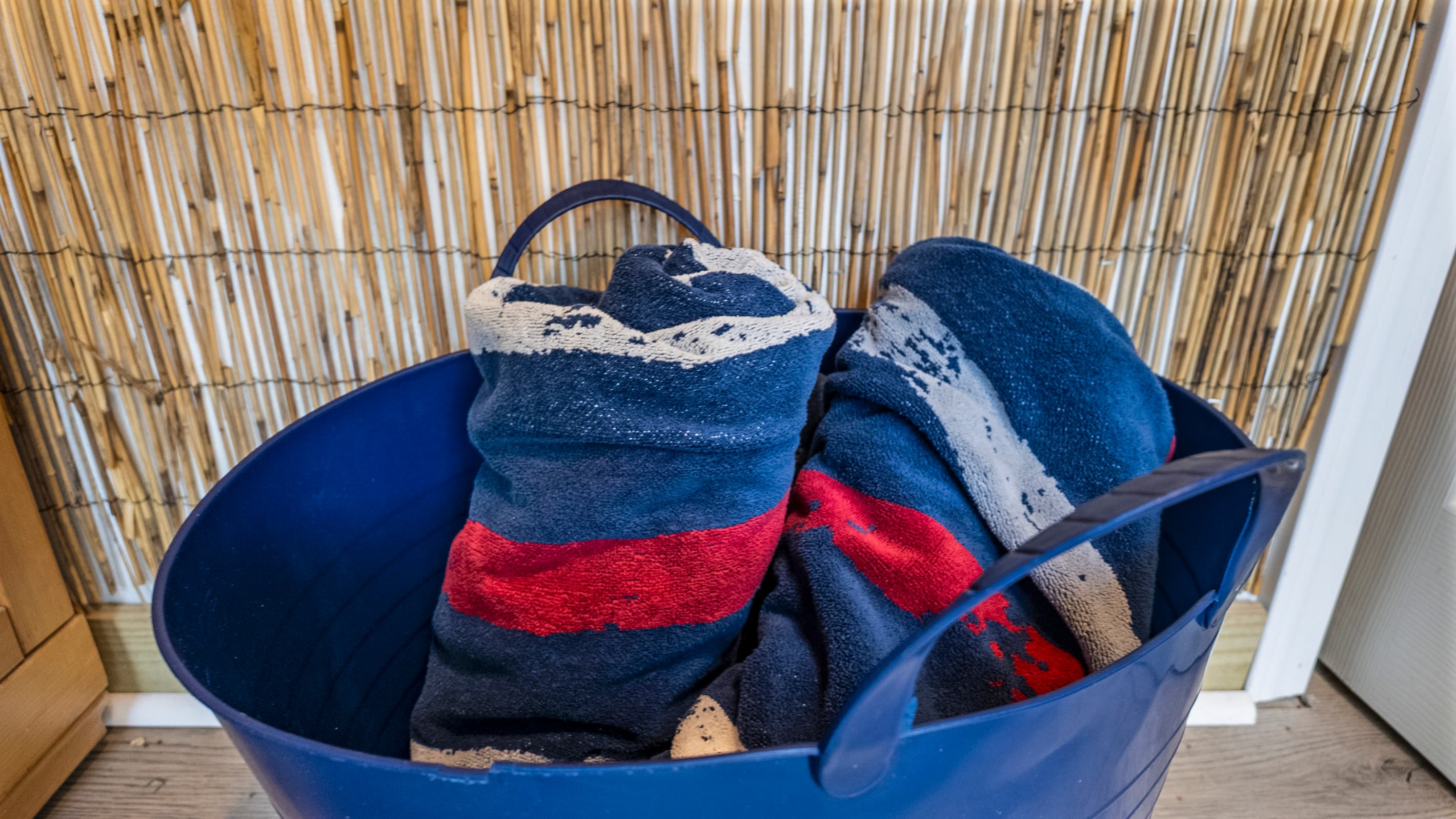 Beach towels ready and waiting at The Lookout at R½ — grab one from the outdoor spa area before heading to the hot tub, sauna, or the Galveston Seawall just steps away.