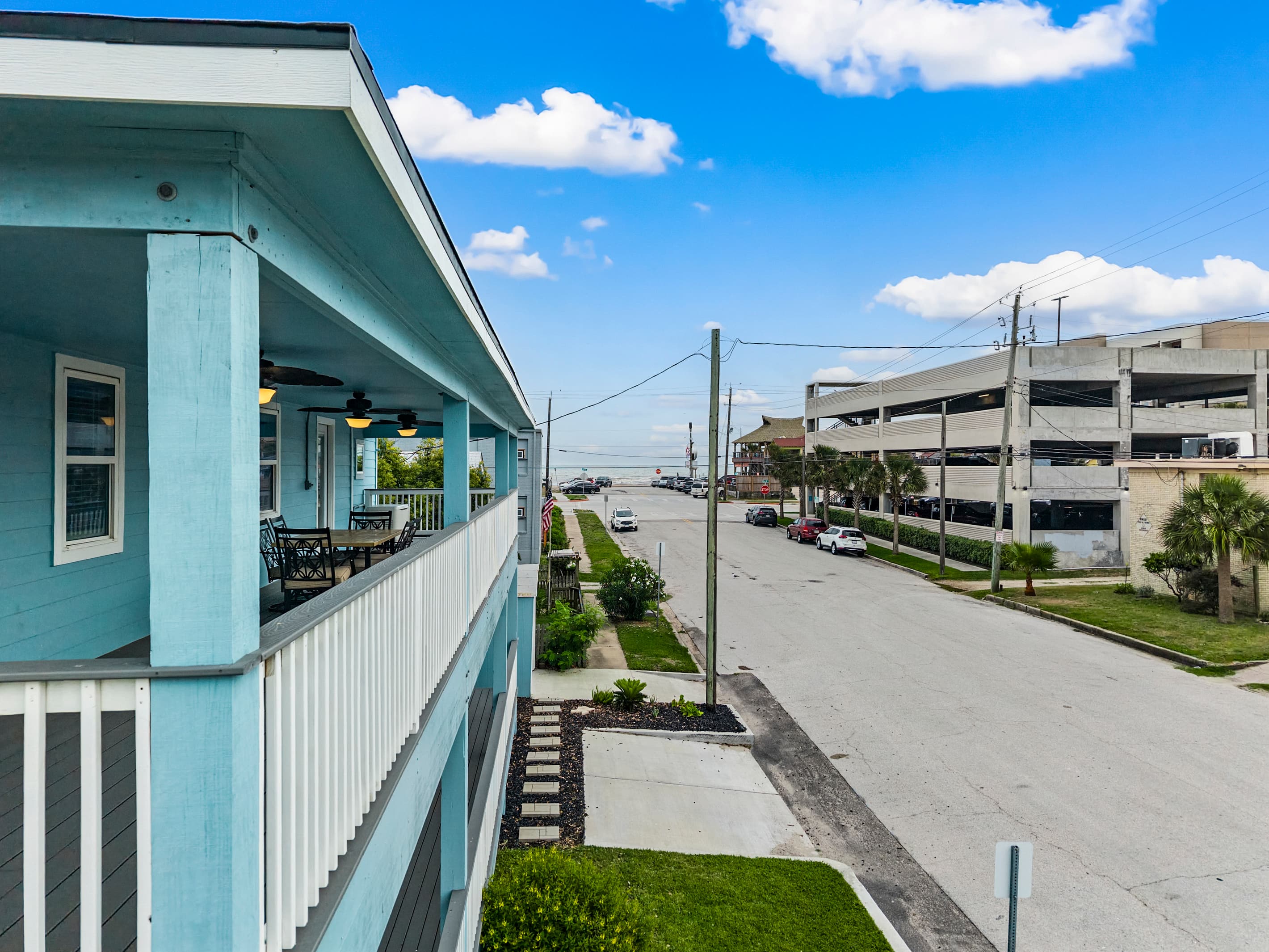 The view from the upper deck at The Lookout at R½ — the Galveston Seawall and beach are straight ahead, just a 2-minute walk from your private outdoor retreat.