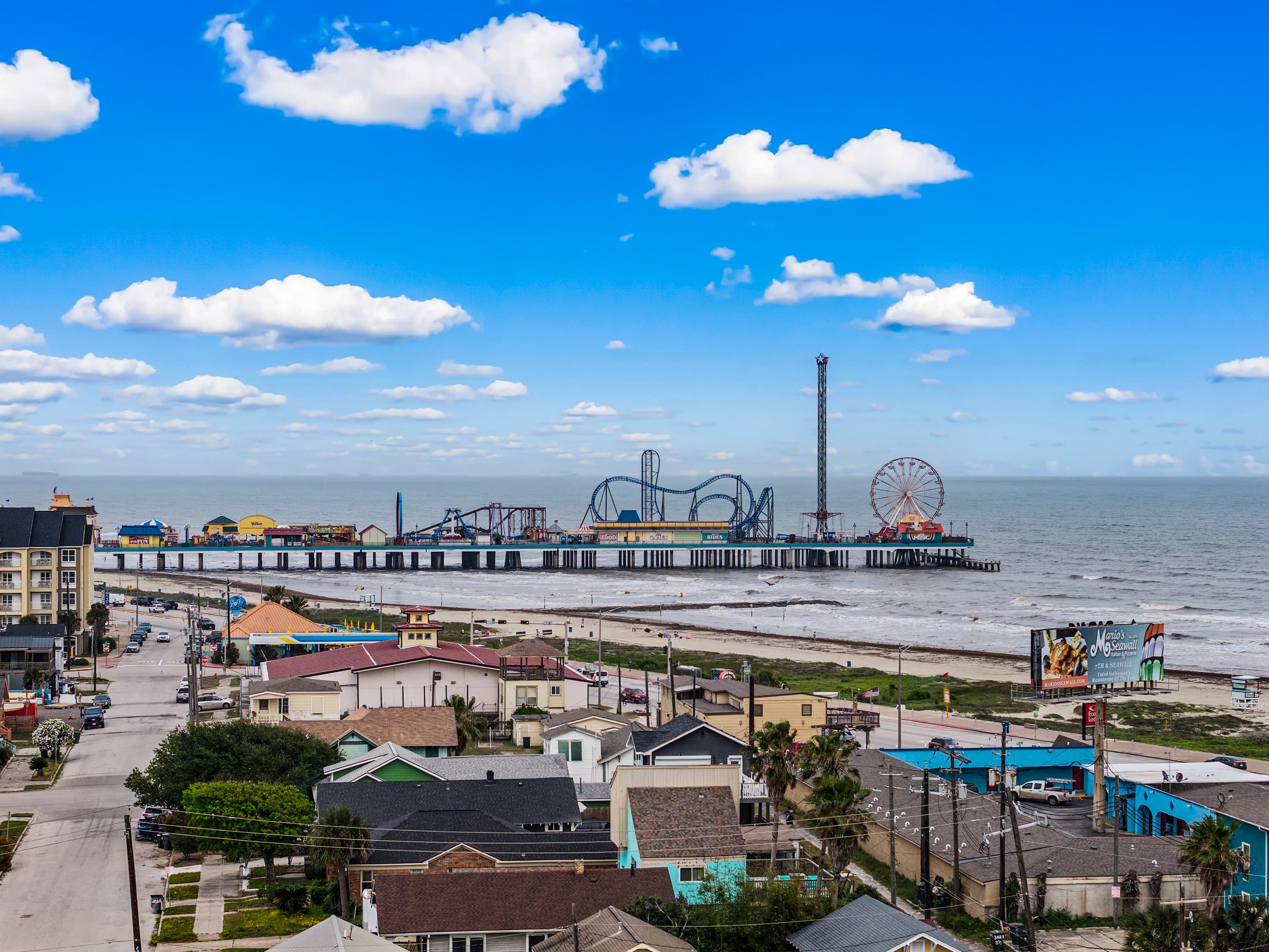 Pleasure Pier — Galveston's iconic beachfront amusement park with a Ferris wheel, roller coasters, and Gulf views — is a short walk from The Lookout at R½.