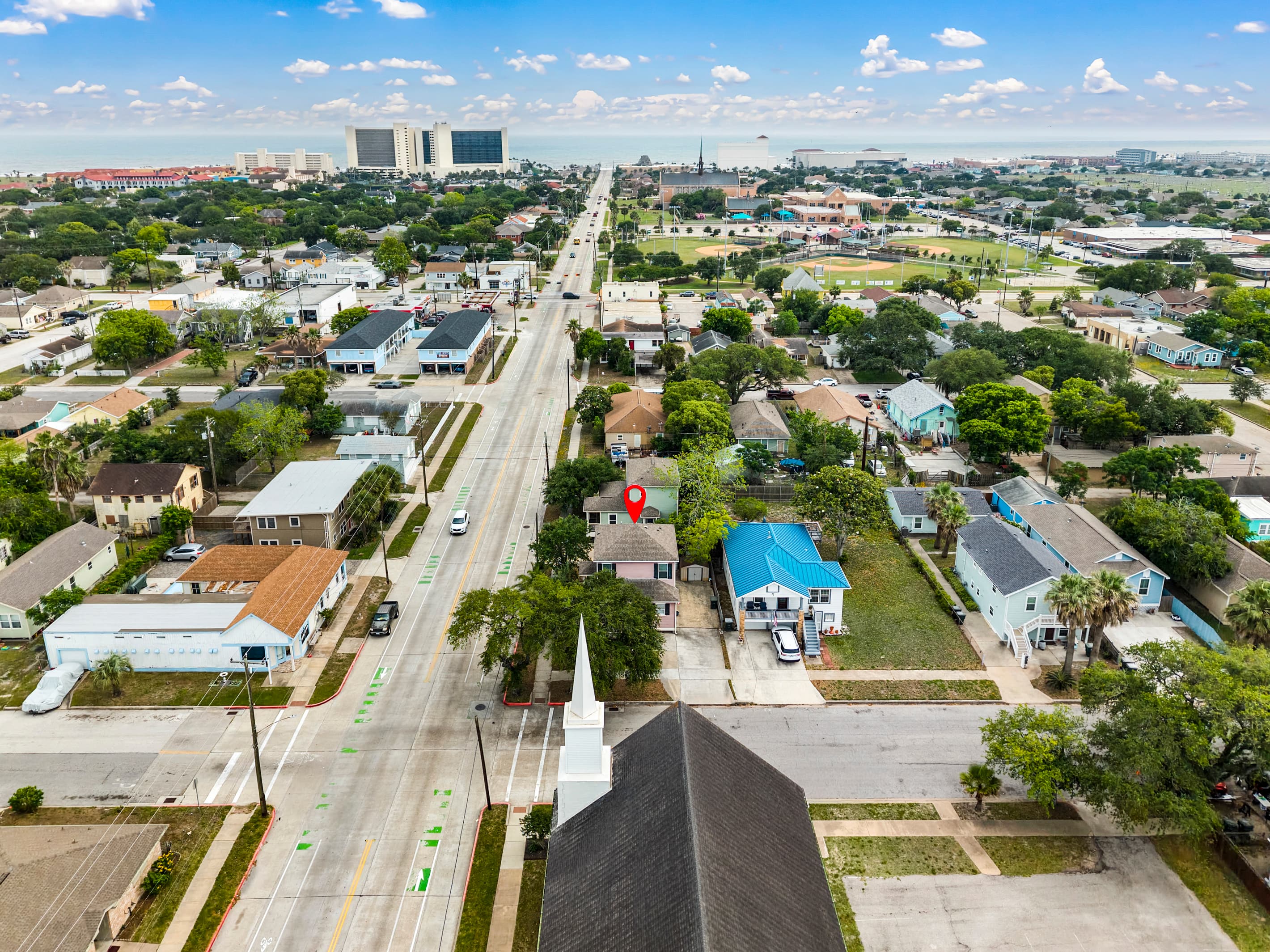 Summer Bliss (pinned) from above — corner lot, large yard, and easy access in every direction. Steps to the beach, minutes to everything Galveston offers.