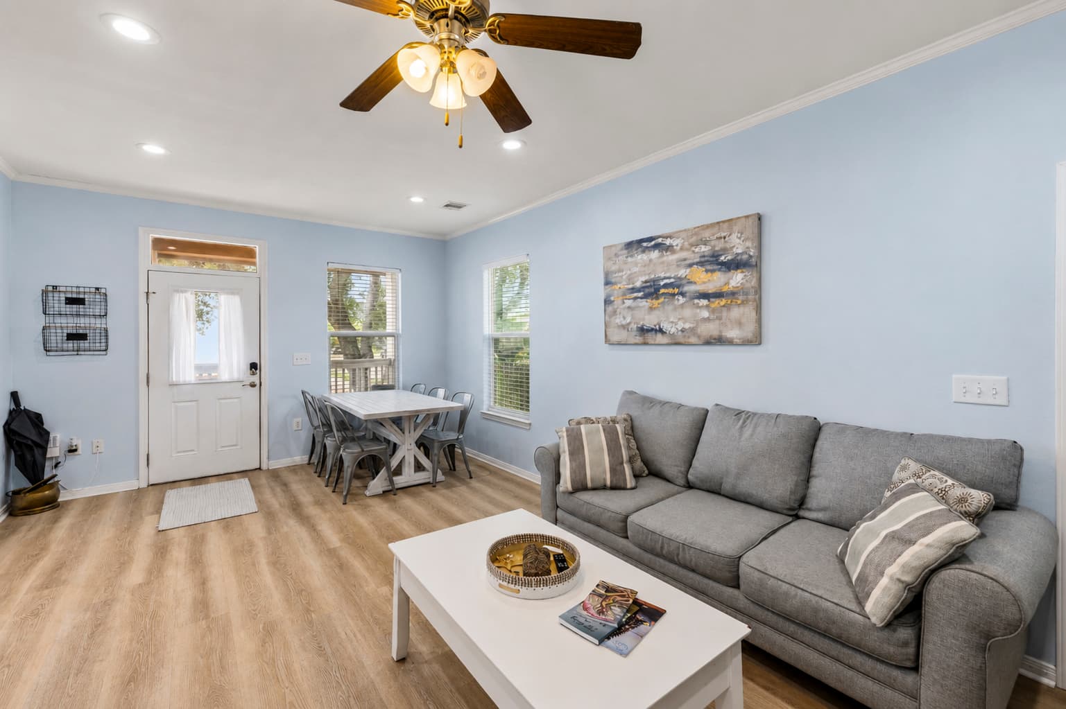 The open plan at Summer Bliss — the living area flows directly into the dining space with the front door just steps away. Easy for groups to gather, relax, and share meals.