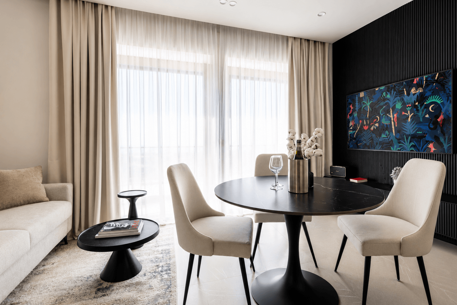 AZULIS DelleTerme Suites Living and dining area with smart TV and round dining table by RENTAL12