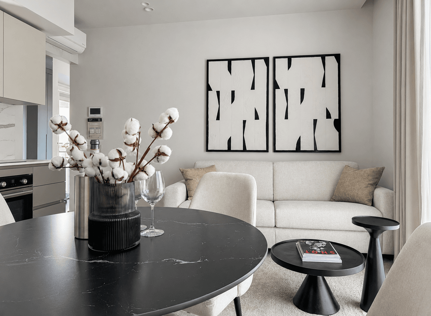 AZULIS DelleTerme Suites Dining table with welcome wine and lounge with modern art by RENTAL12